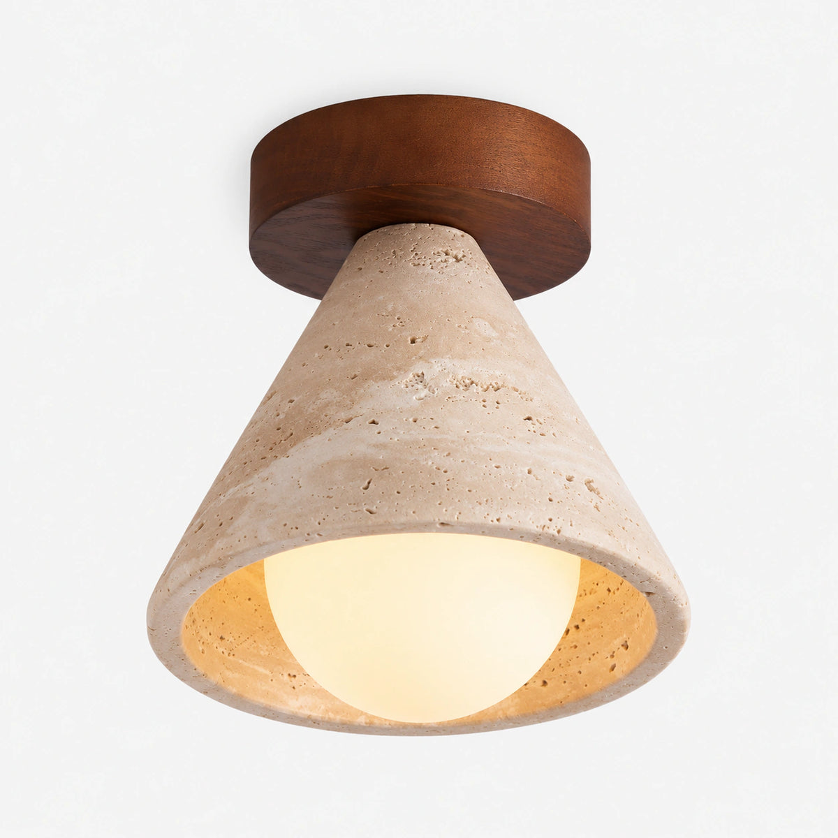 Travertine cone ceiling light with an opal globe and walnut collar on a white background