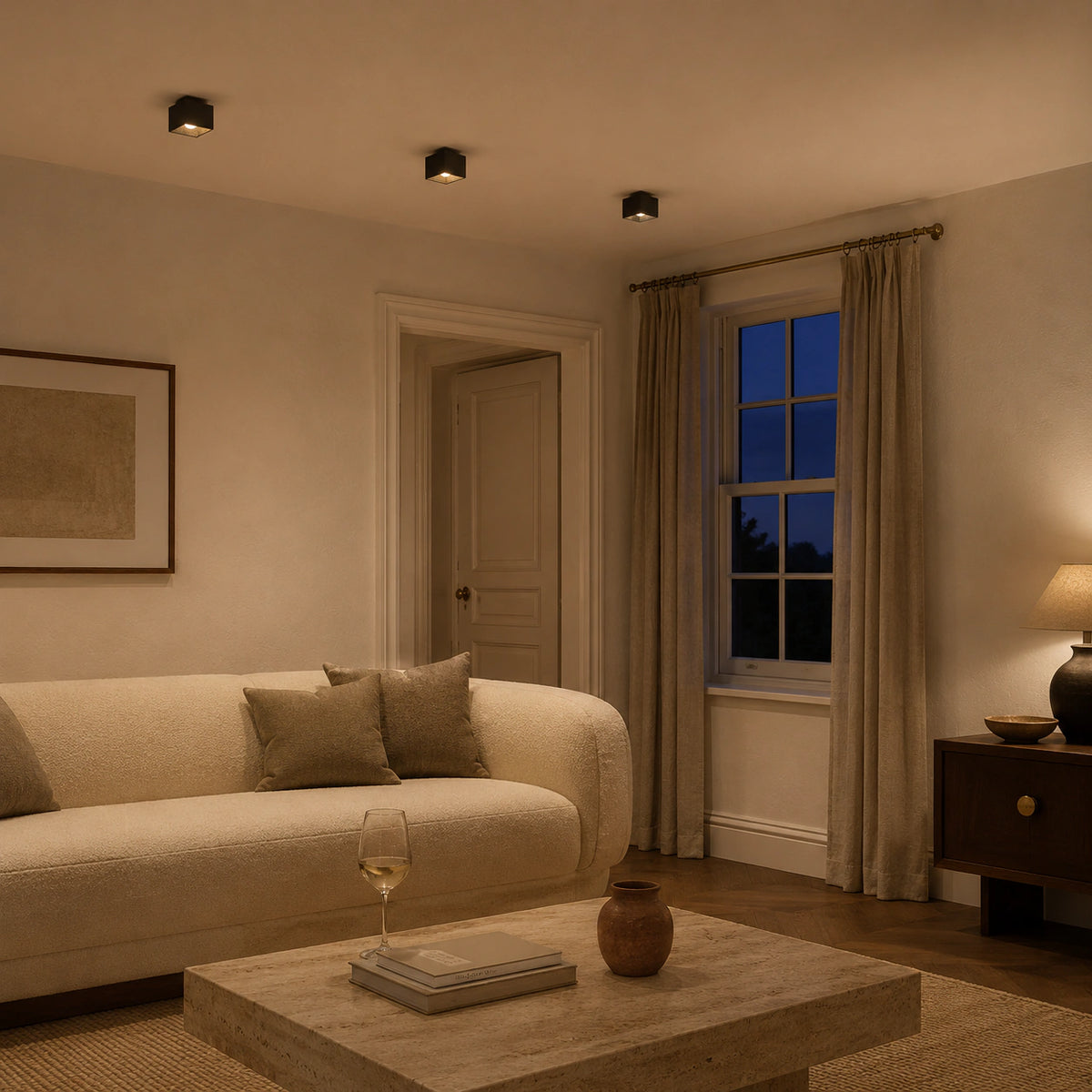 Black travertine cube ceiling light in a calm neutral living room