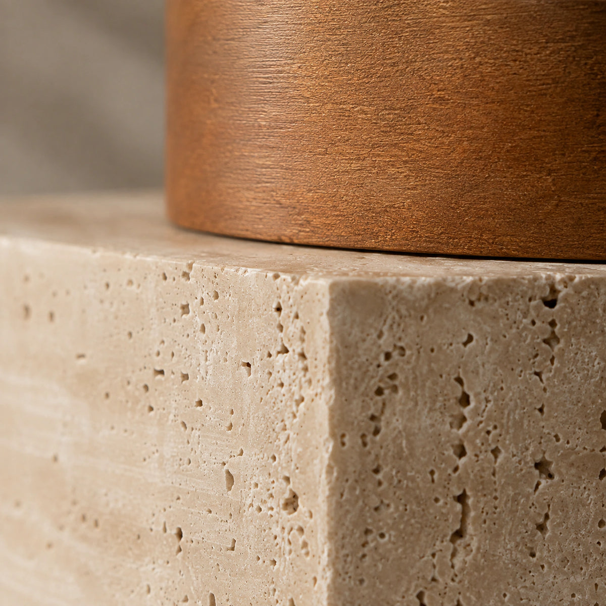 Close-up of the open travertine grain on the cube ceiling light