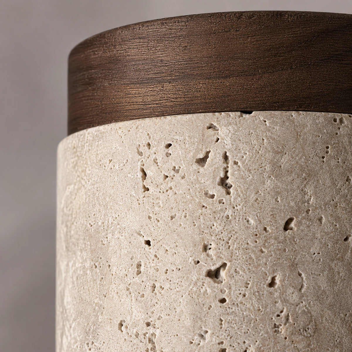 Close-up of the travertine grain on the walnut version of the cylinder ceiling light