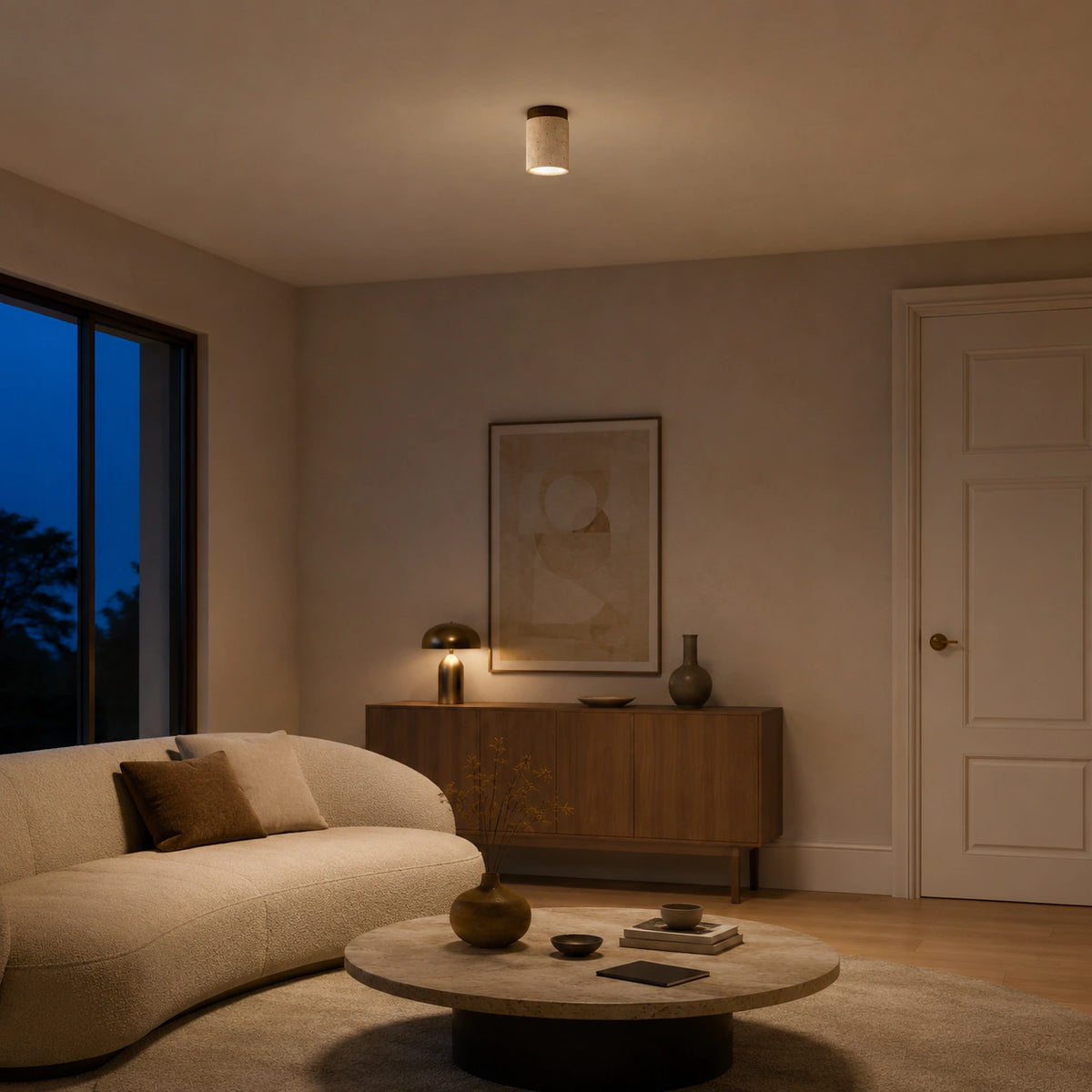 Travertine cylinder ceiling light with a walnut collar in a neutral living room