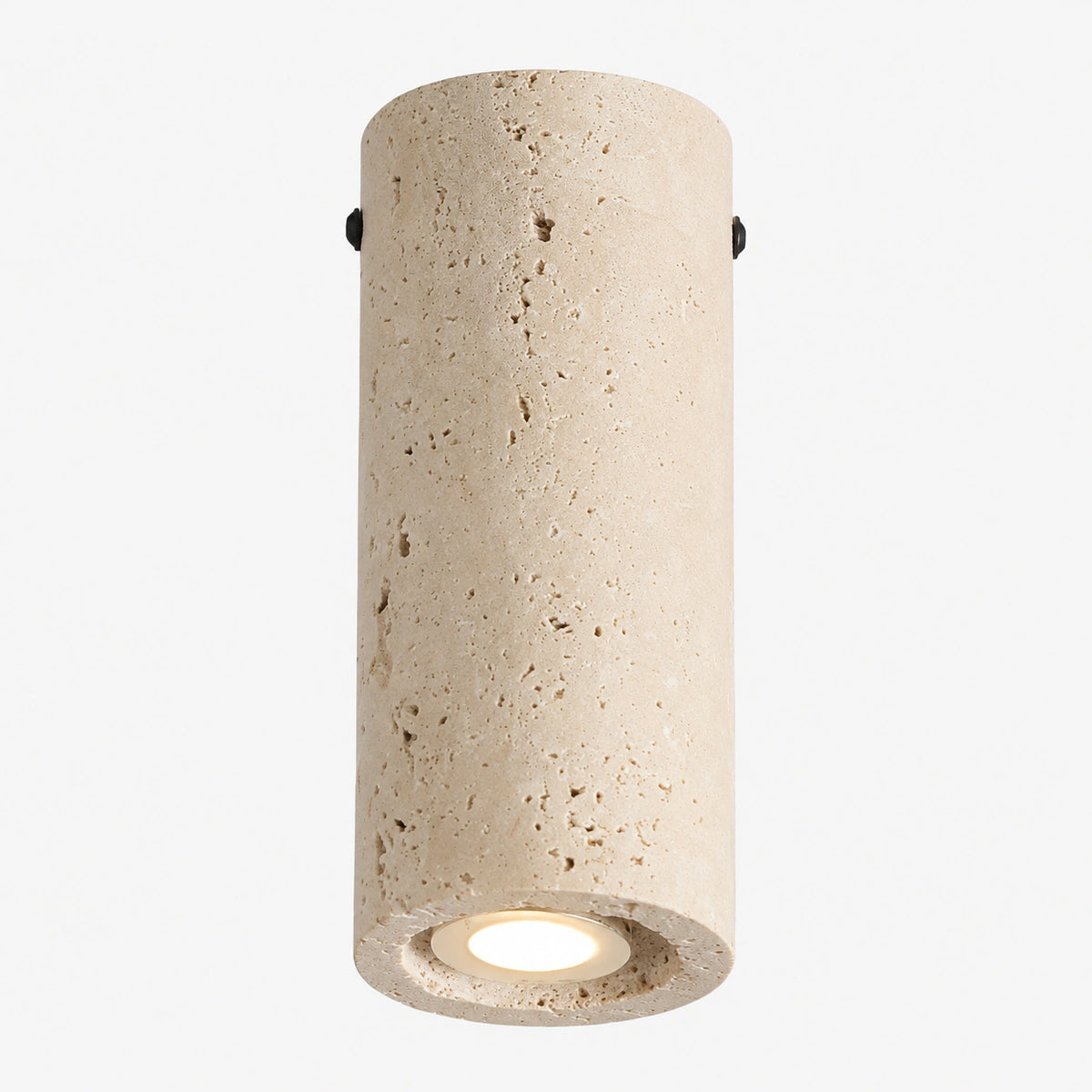 Solid travertine tube downlight on a white background