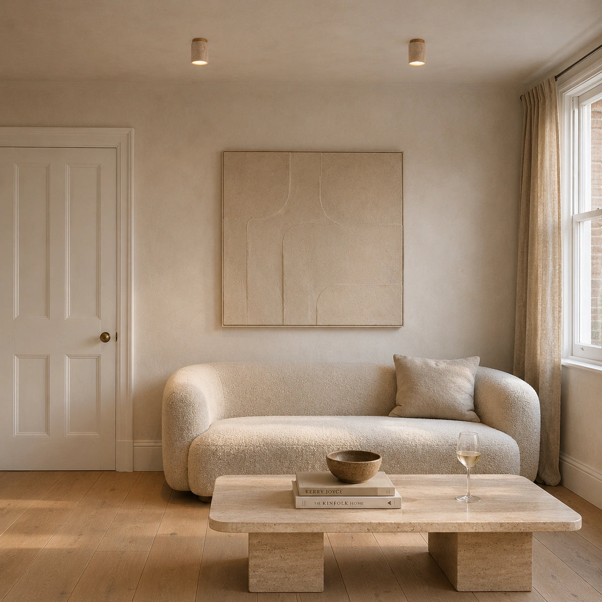 Travertine cylinder ceiling light in a calm neutral living room