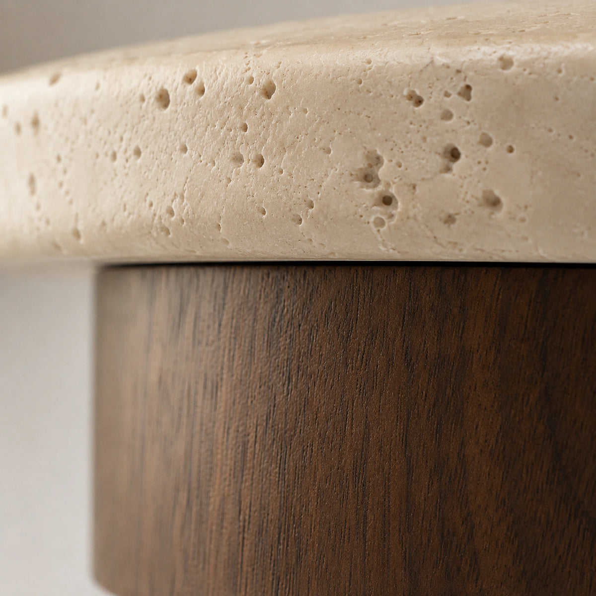 Close-up of the travertine grain on the walnut version of the disc ceiling light