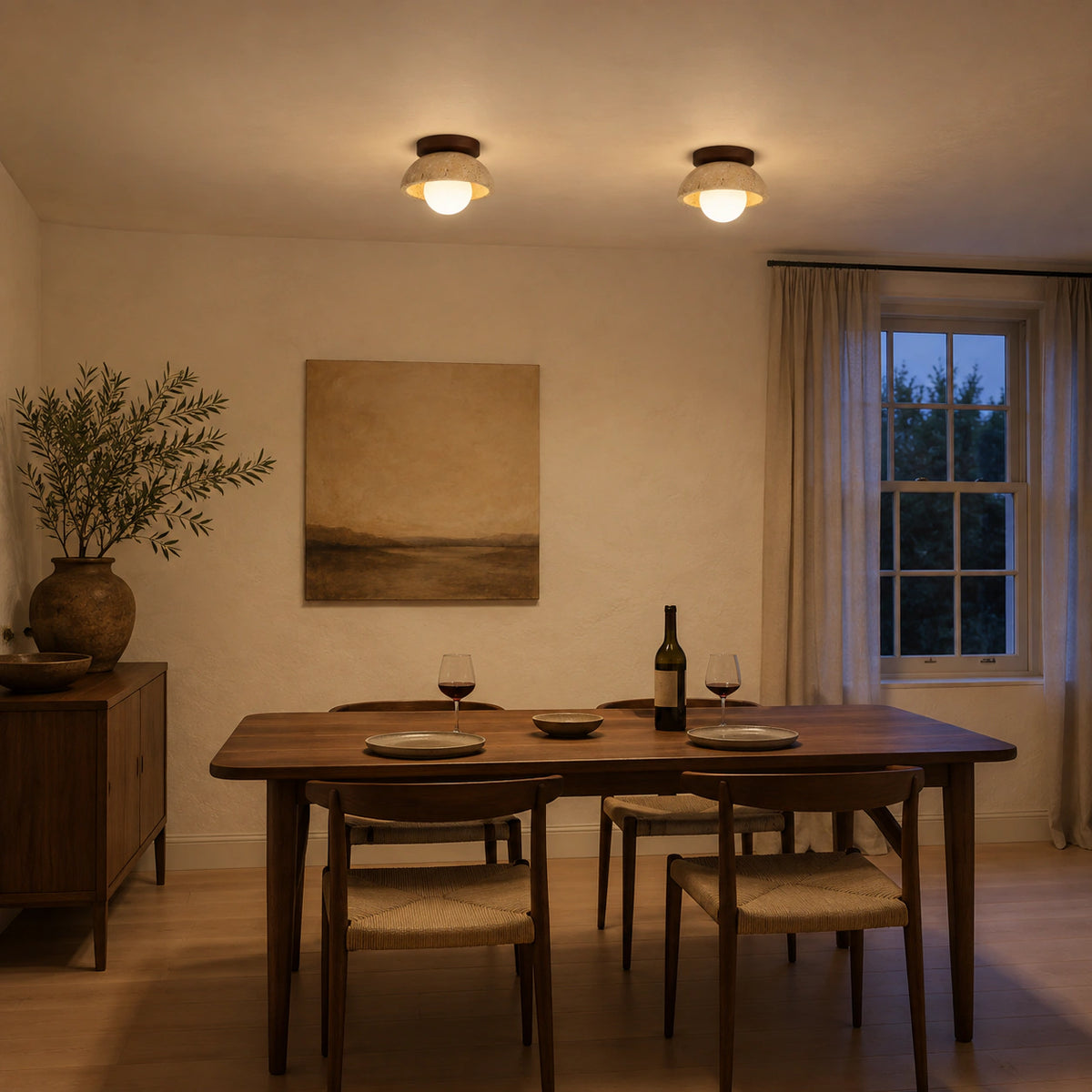 Travertine dome ceiling light lighting a minimalist dining room