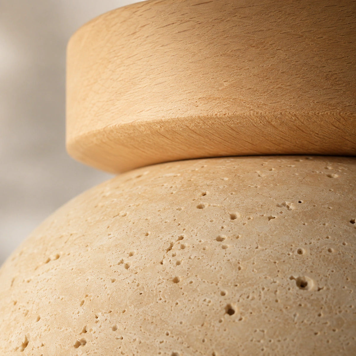 Close-up of the open travertine grain on the dome ceiling light