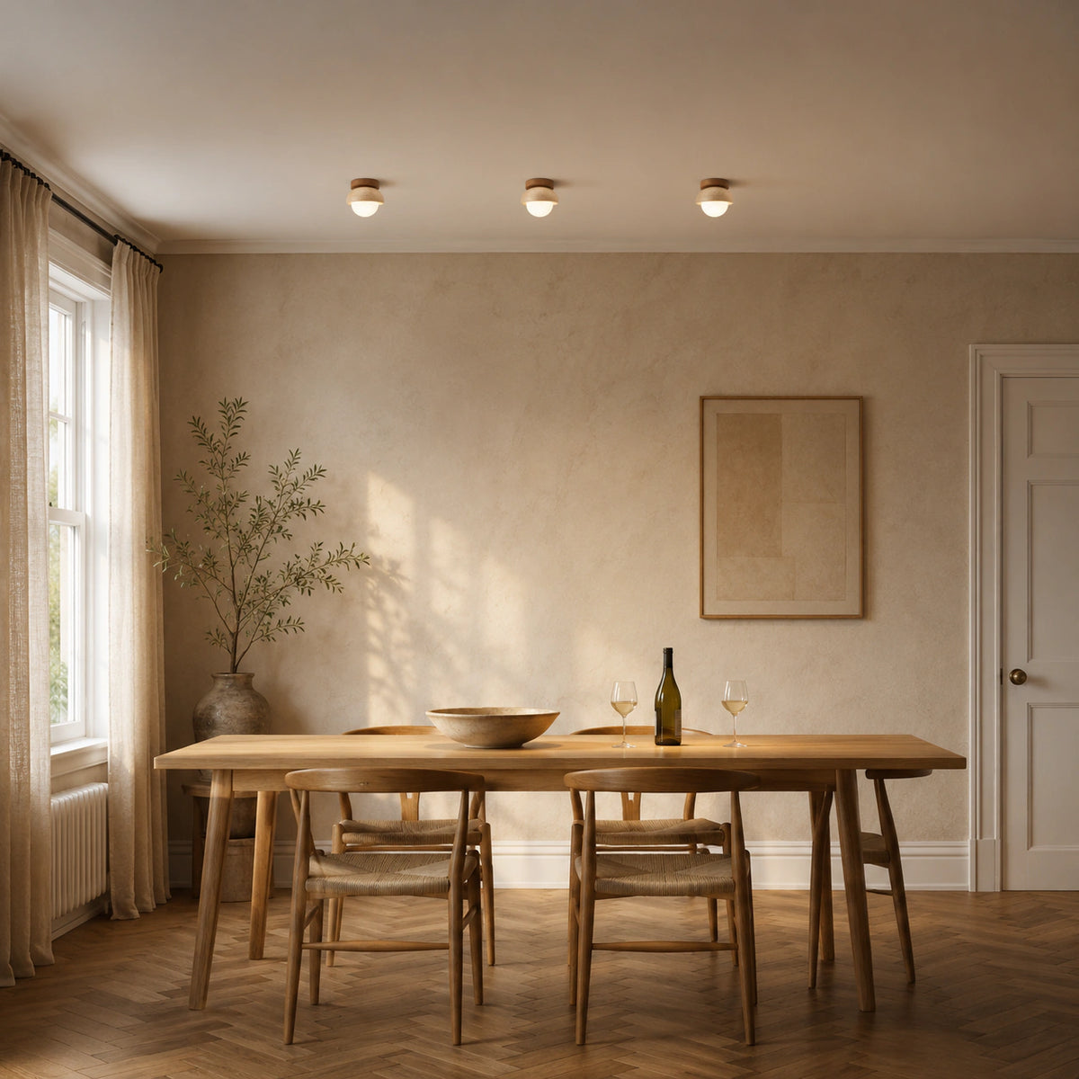 Travertine dome ceiling light with an oak collar lighting a minimalist dining room