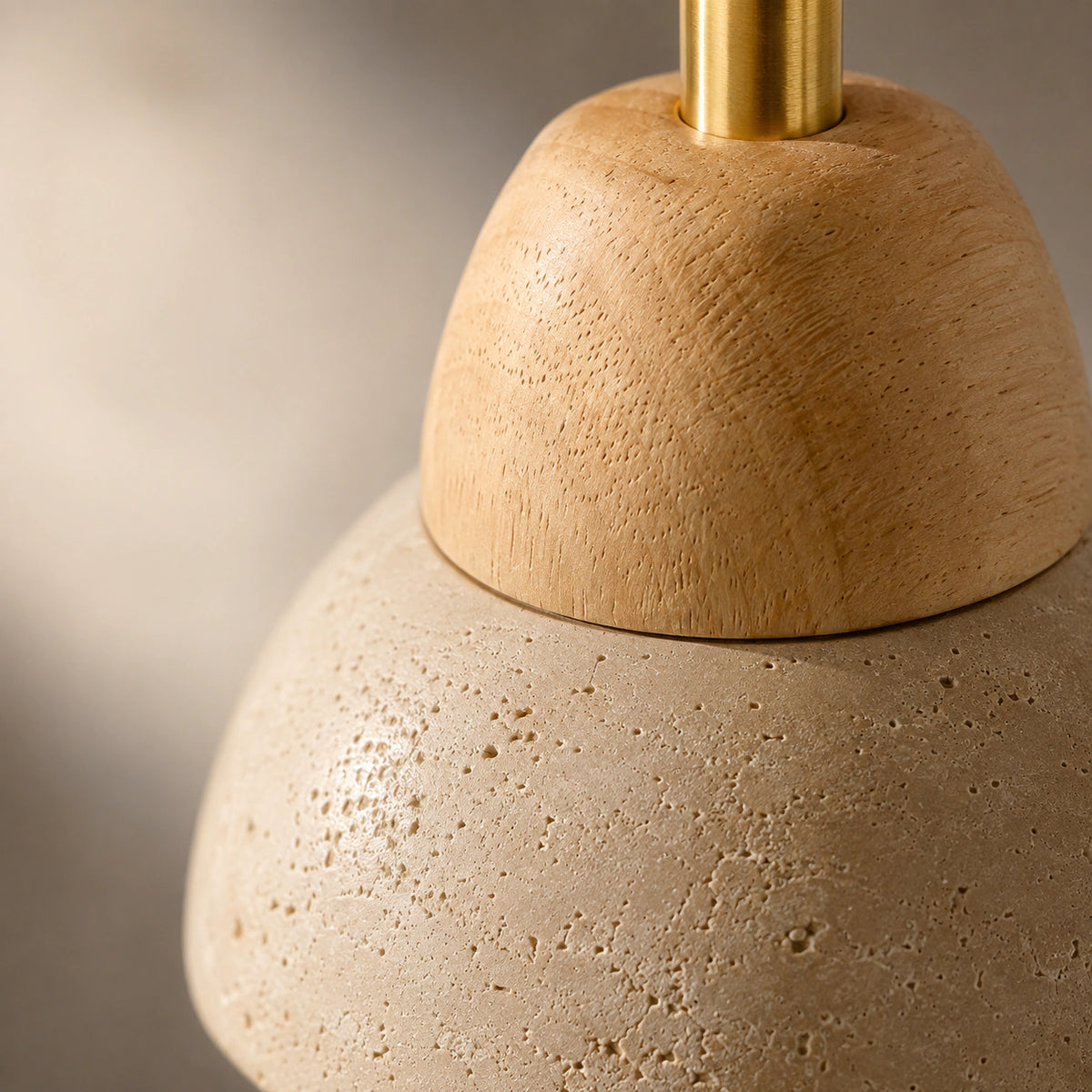 Close-up of the travertine grain on the adjustable dome spotlight