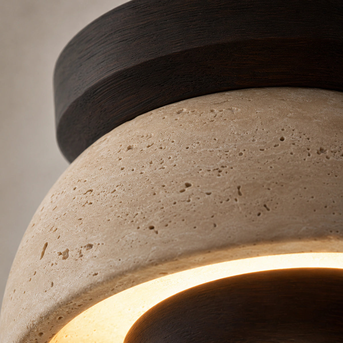 Close-up of the travertine grain on the walnut version of the ceiling light with a reflector