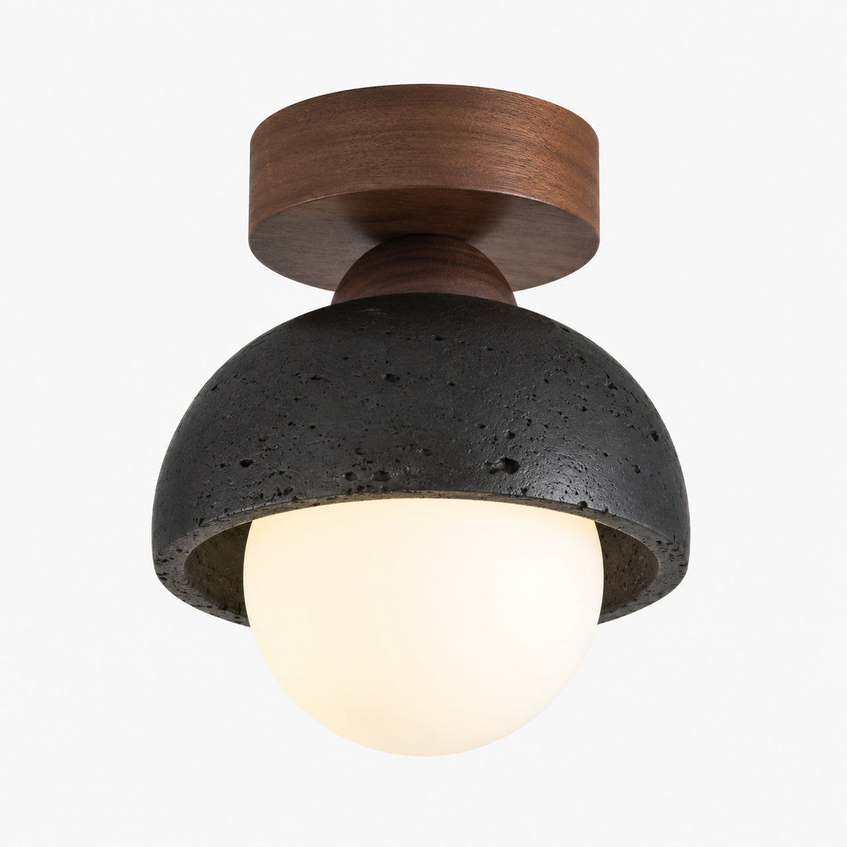 Black travertine dome ceiling light with an opal globe, flush mount, on a white background