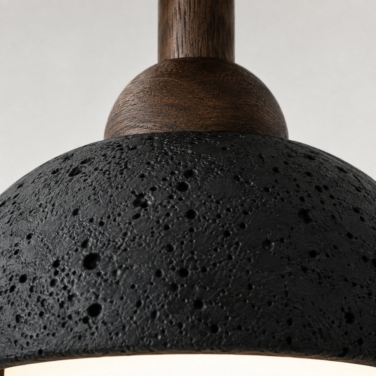 Close-up of the black travertine grain on the semi flush dome ceiling light