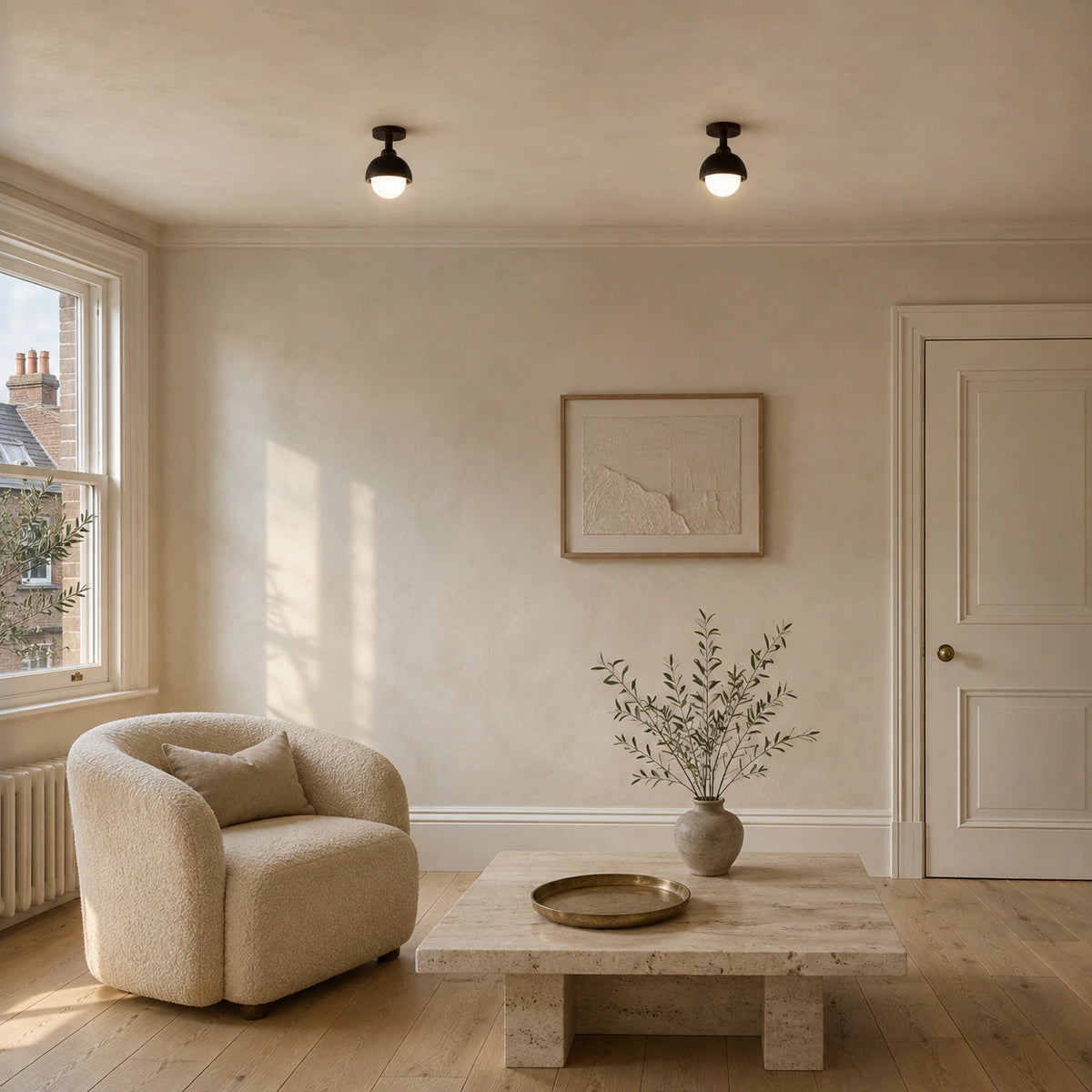 Black travertine dome ceiling light on a drop in a calm neutral living room