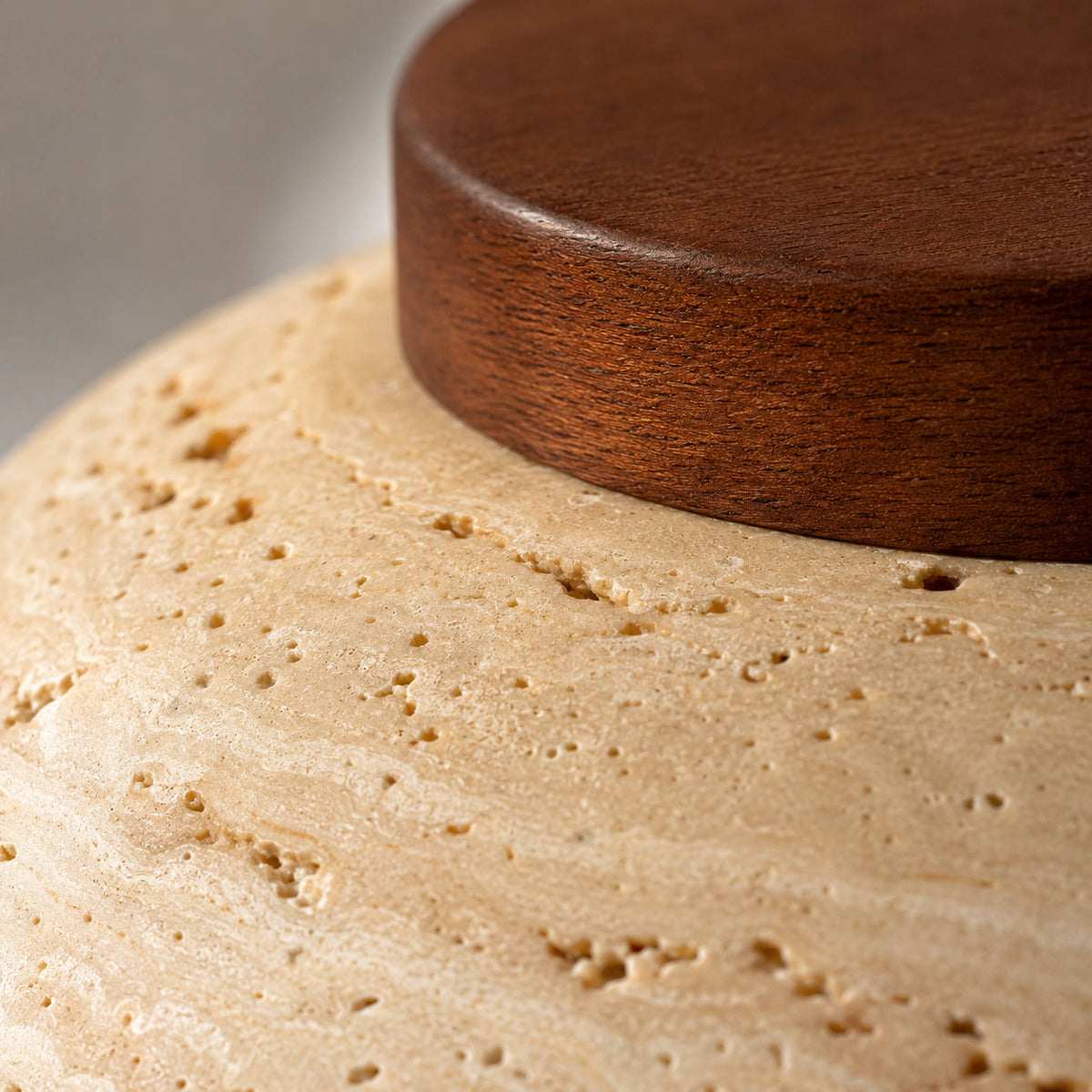 Close-up of the travertine grain on the wide dish ceiling light