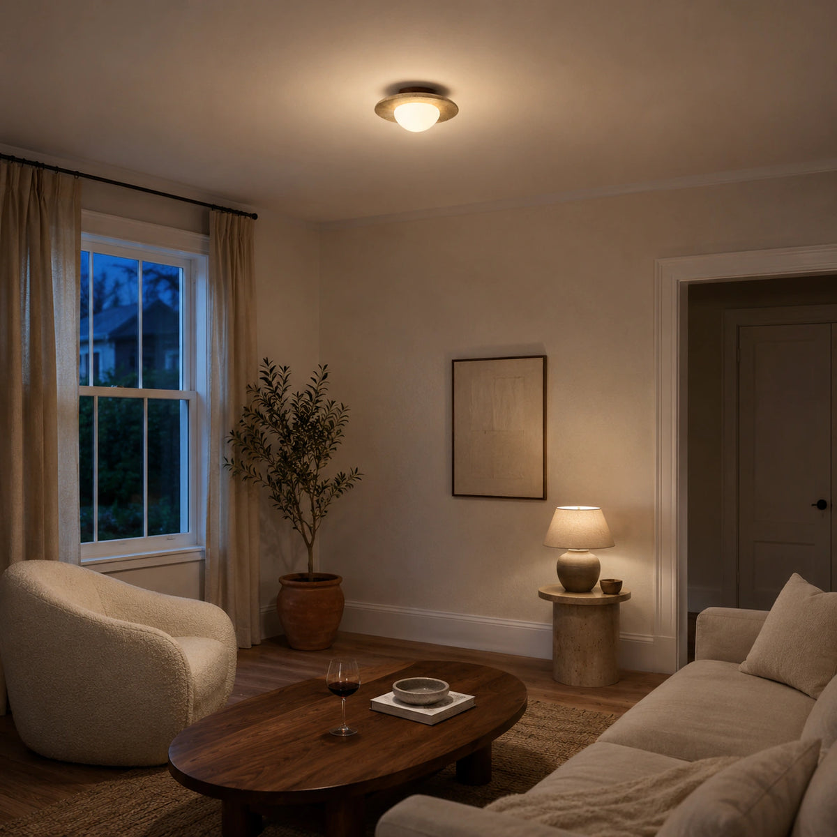 Flat travertine dish ceiling light in a calm neutral living room