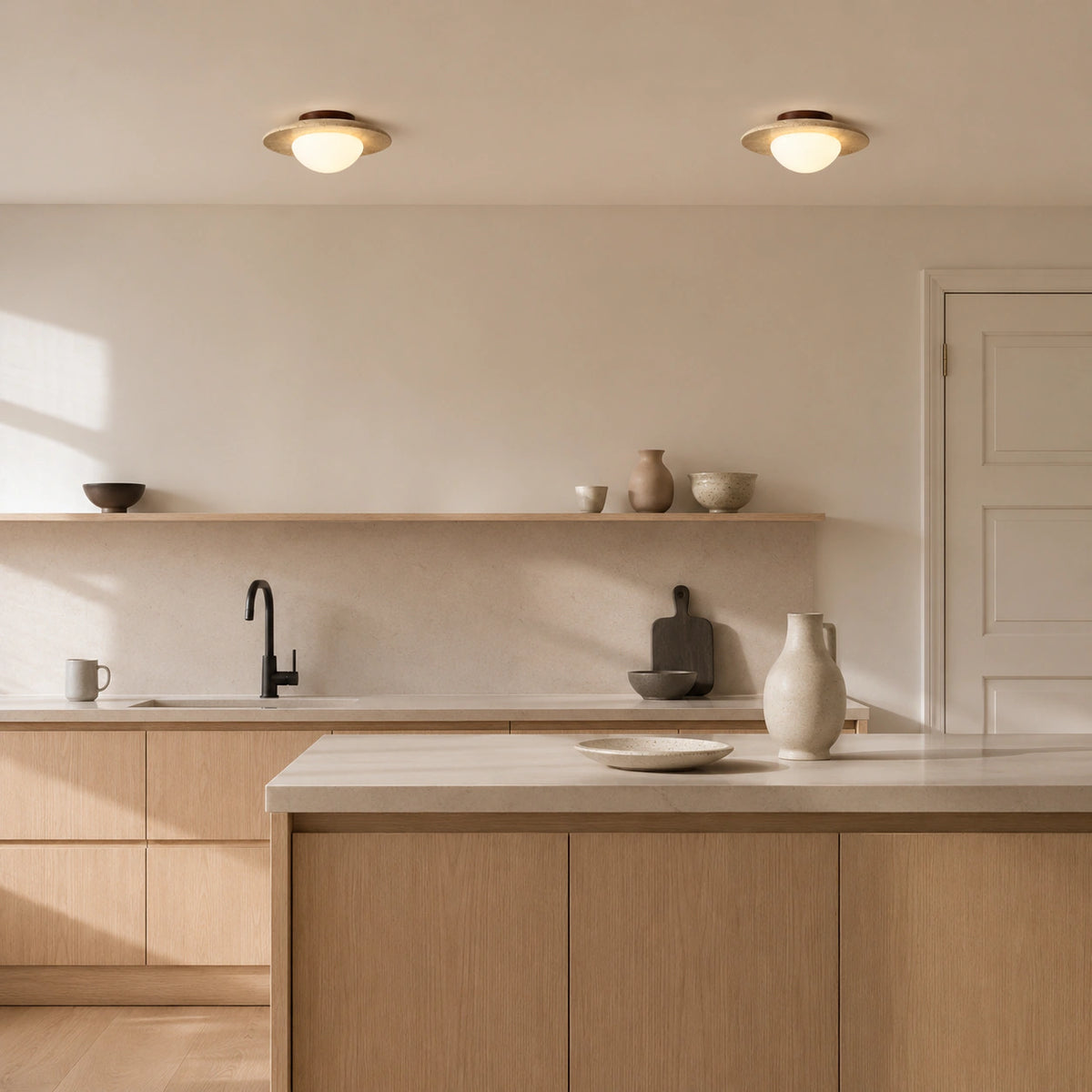 Flat travertine dish ceiling light in a warm oak kitchen