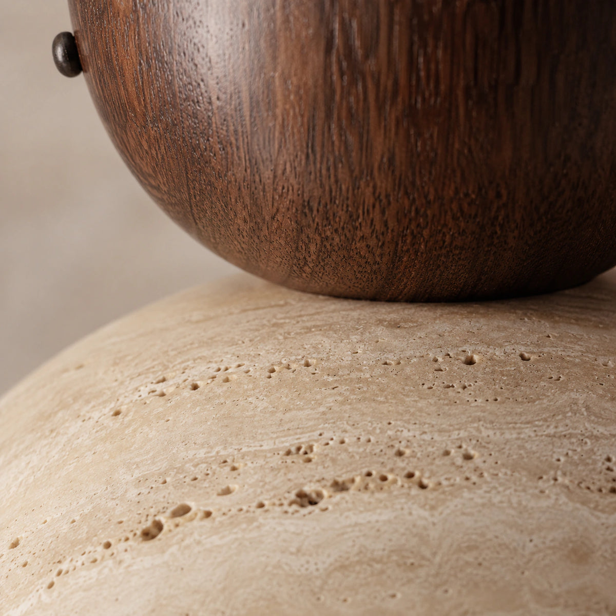 Close-up of the travertine grain on the walnut version of the deep dome ceiling light