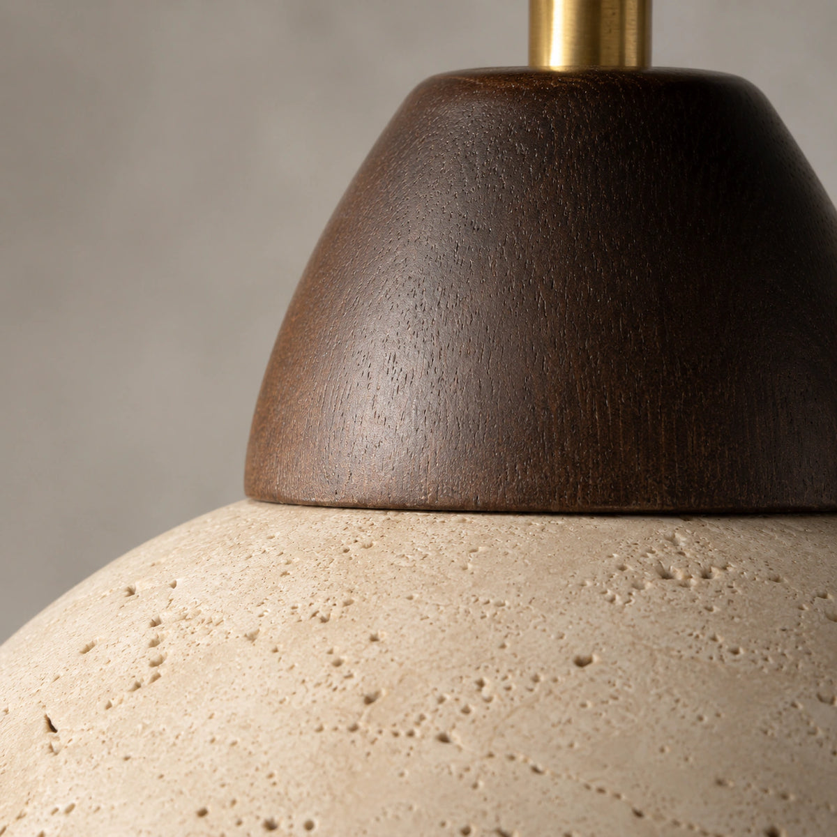 Close-up of the travertine grain on the walnut version of the adjustable dome spotlight