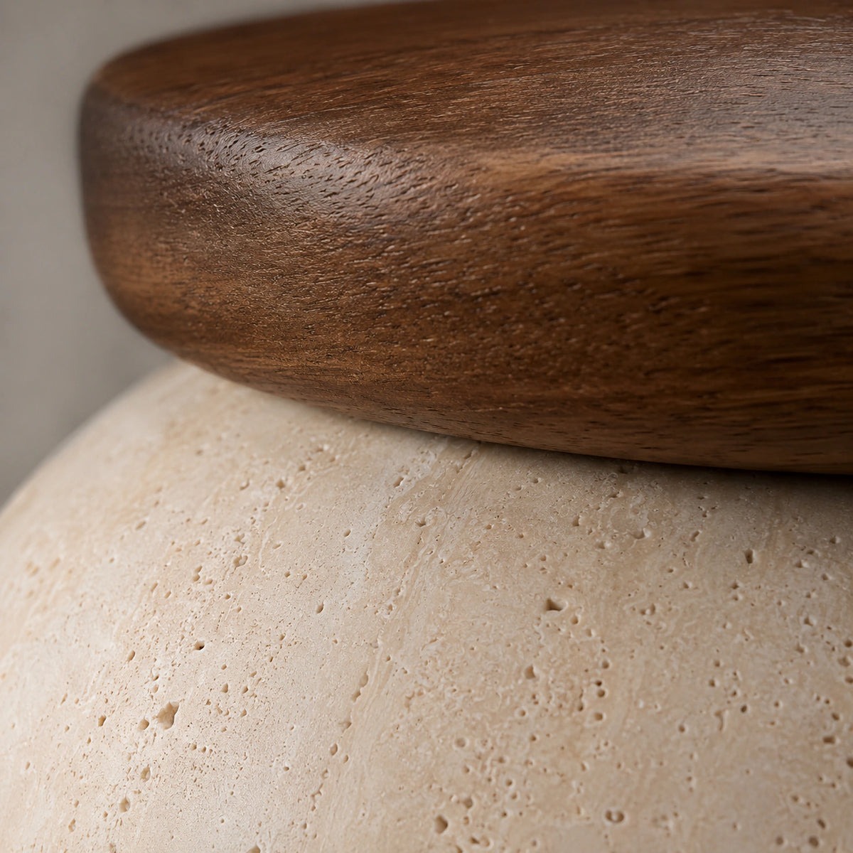 Close-up of the travertine grain on the ceiling light with a wood reflector