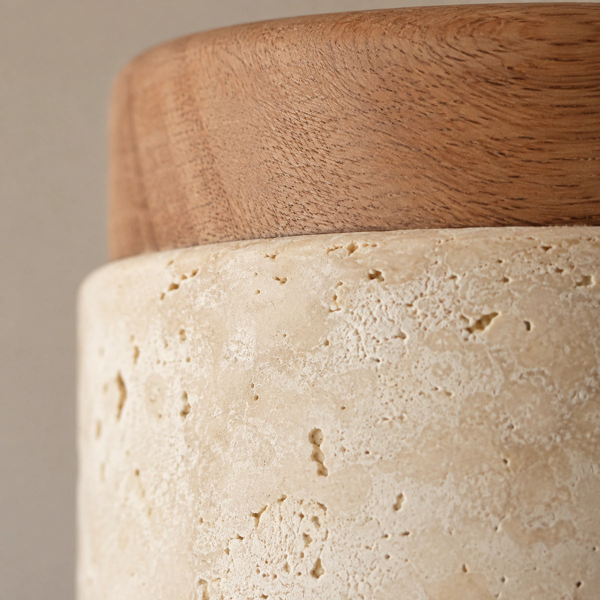 Close-up of the open travertine grain on the drum ceiling light