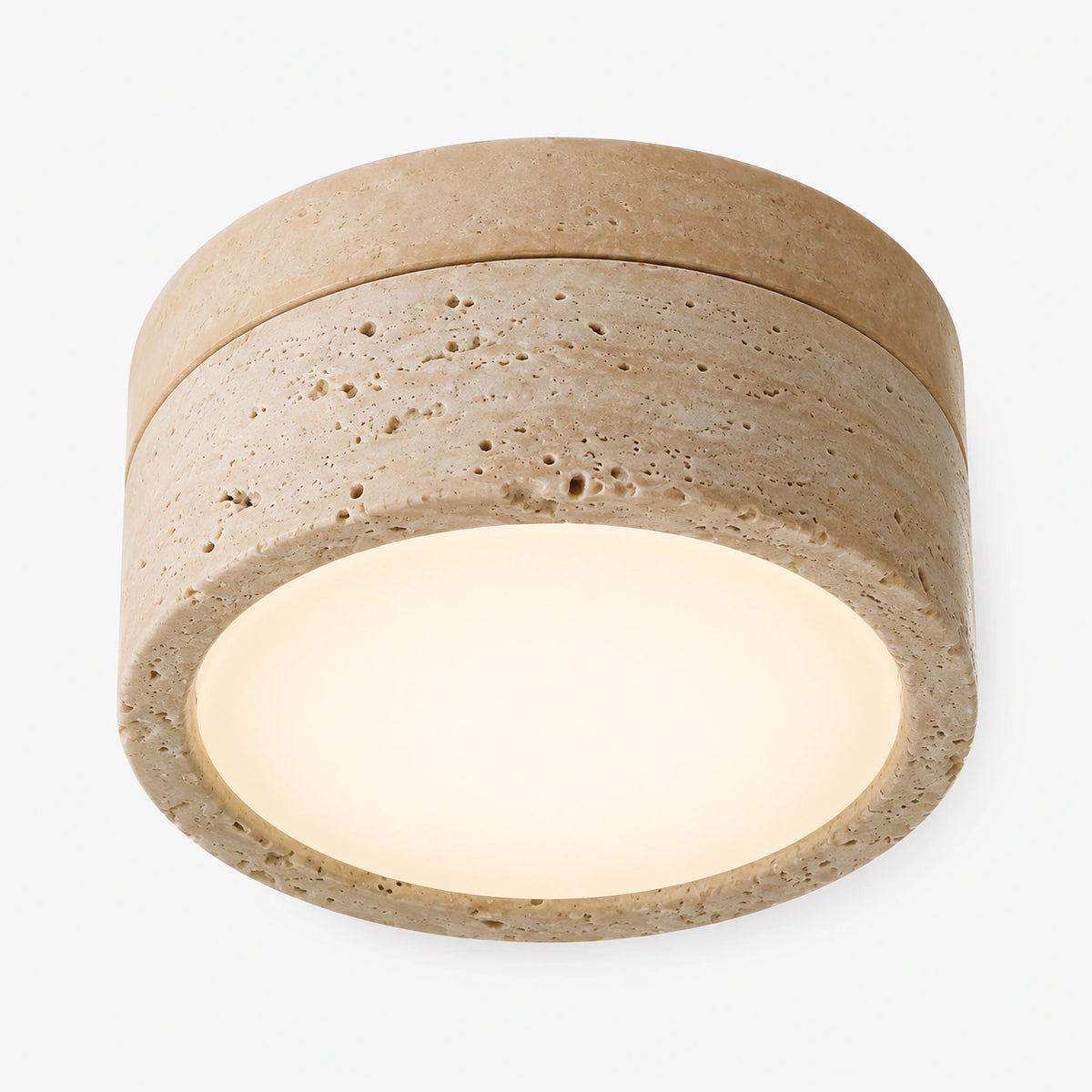 All stone travertine flush ceiling light on a white background