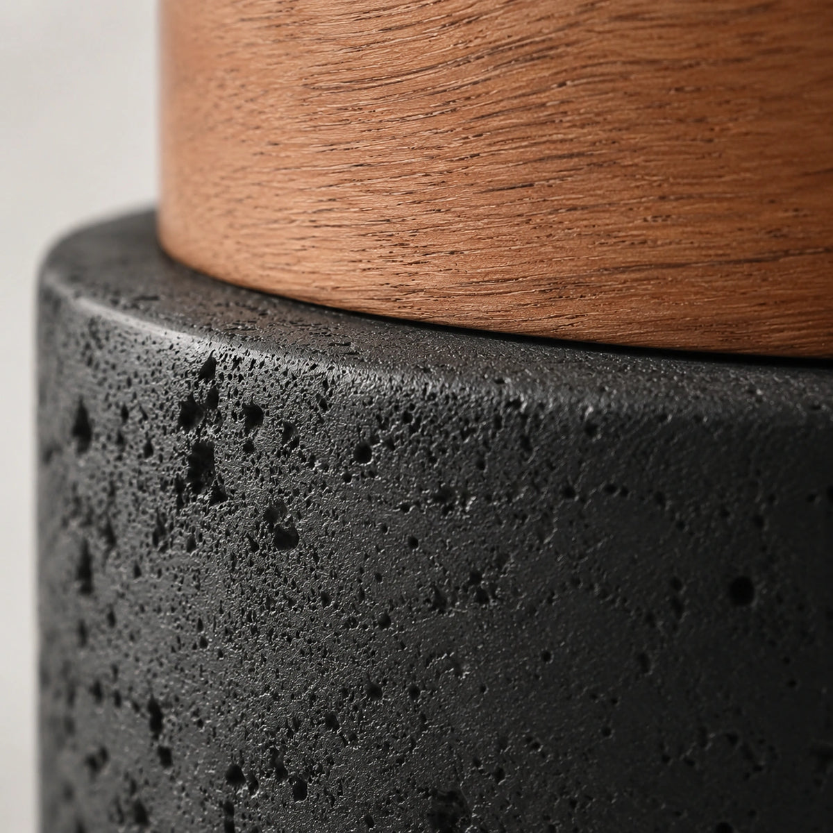 Close-up of the deep pitting in the black travertine drum ceiling light