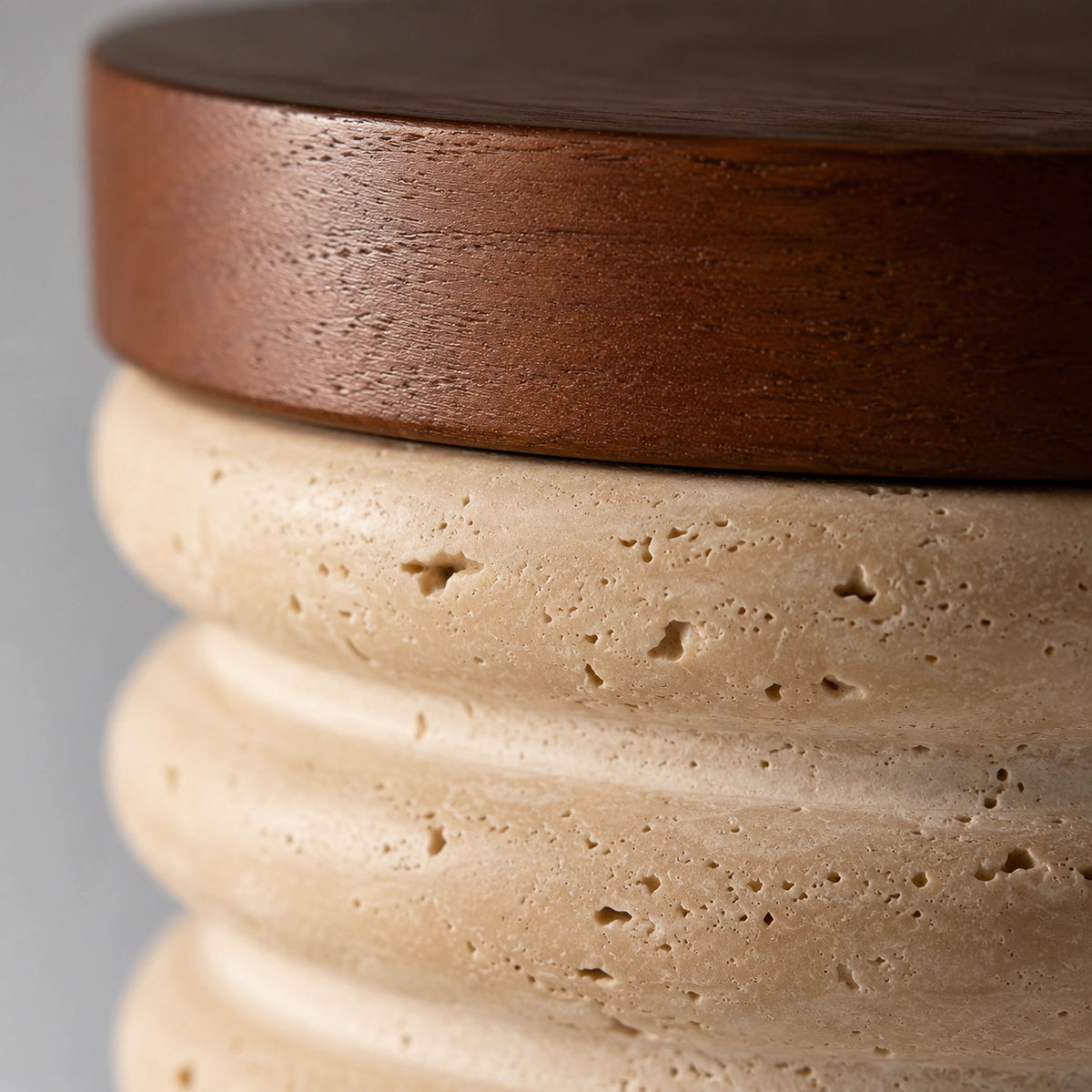 Close-up of the ribbed travertine surface on the fluted ceiling light