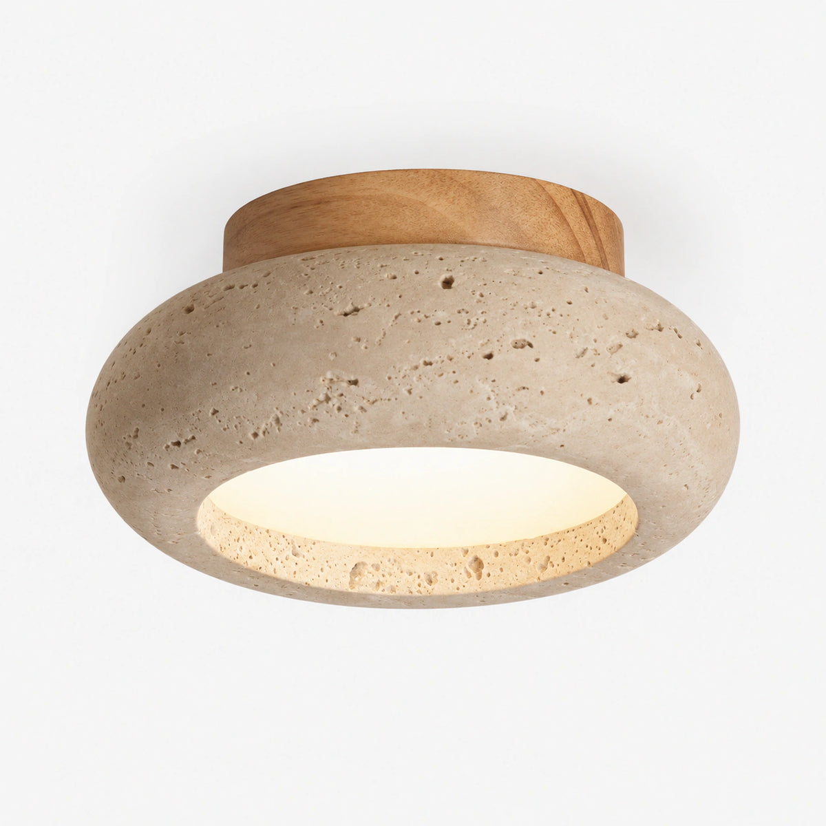 Travertine pebble flush ceiling light with an oak collar on a white background