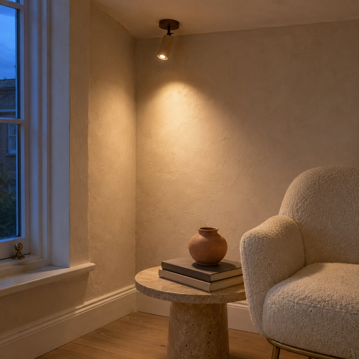 Travertine adjustable ceiling spotlight in a calm neutral living room