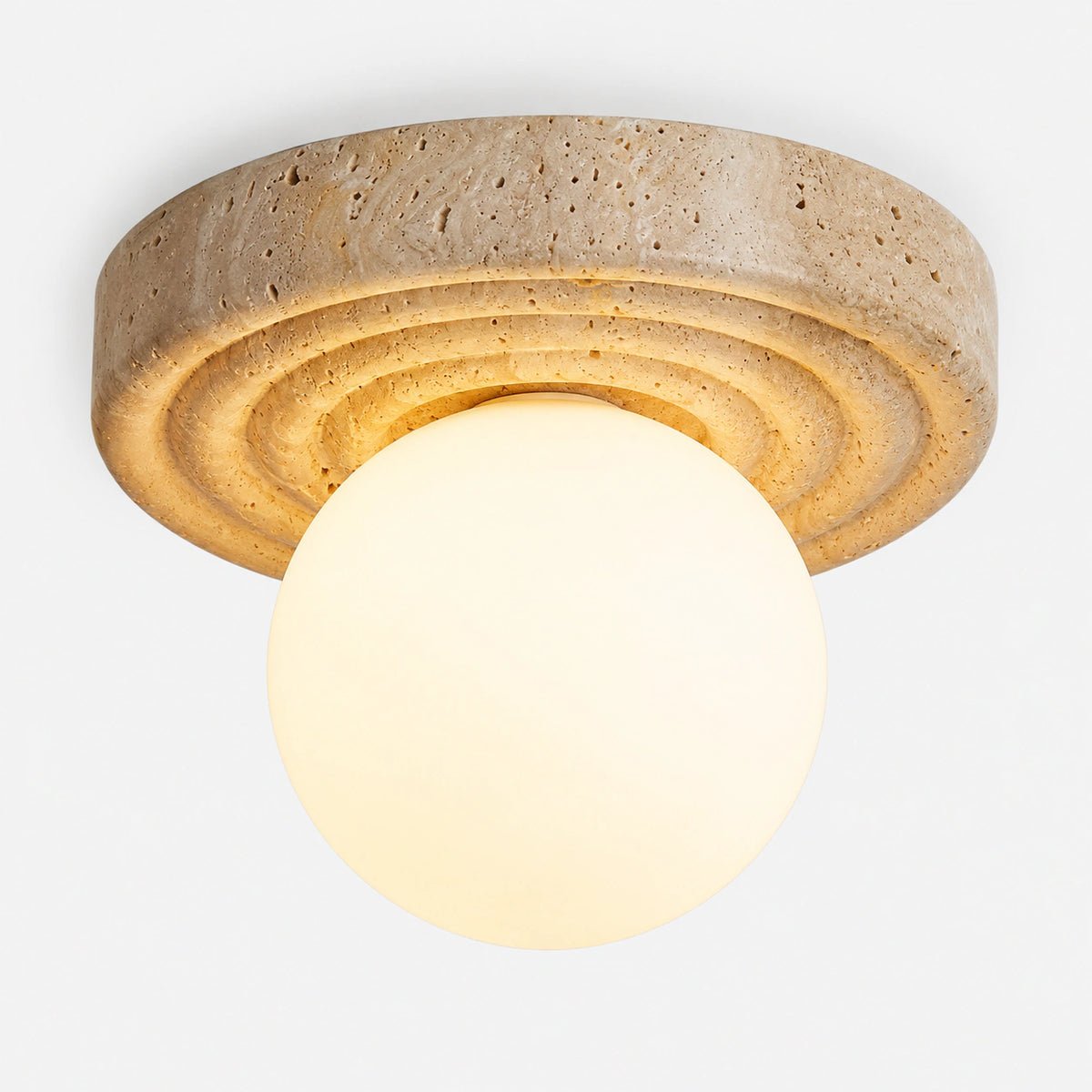 Stepped travertine ceiling light with an opal globe on a white background