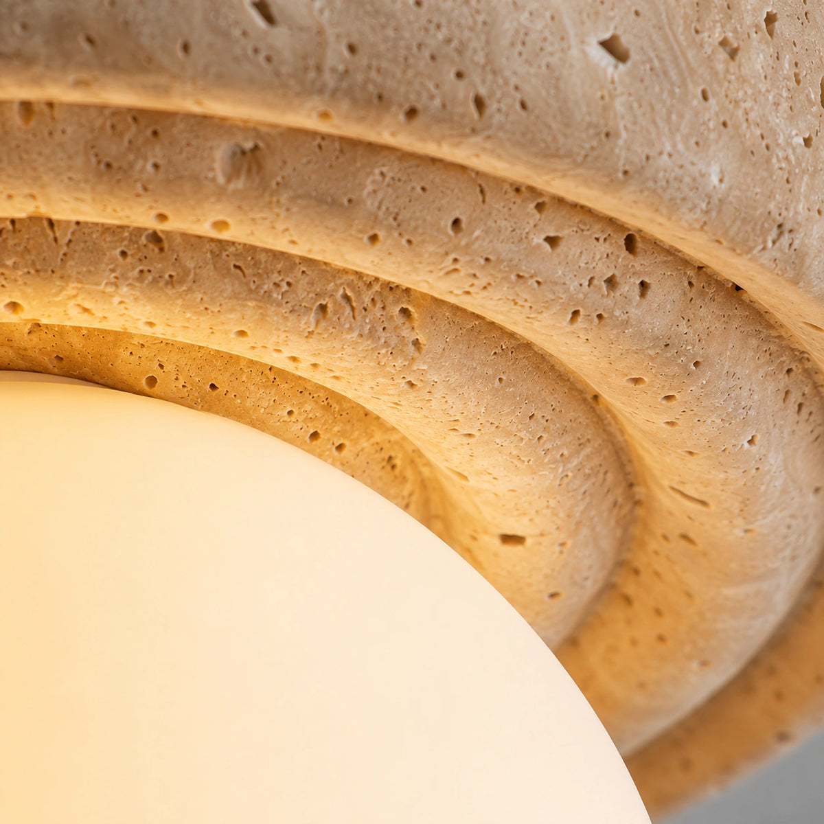 Close-up of the travertine grain on the stepped ceiling light