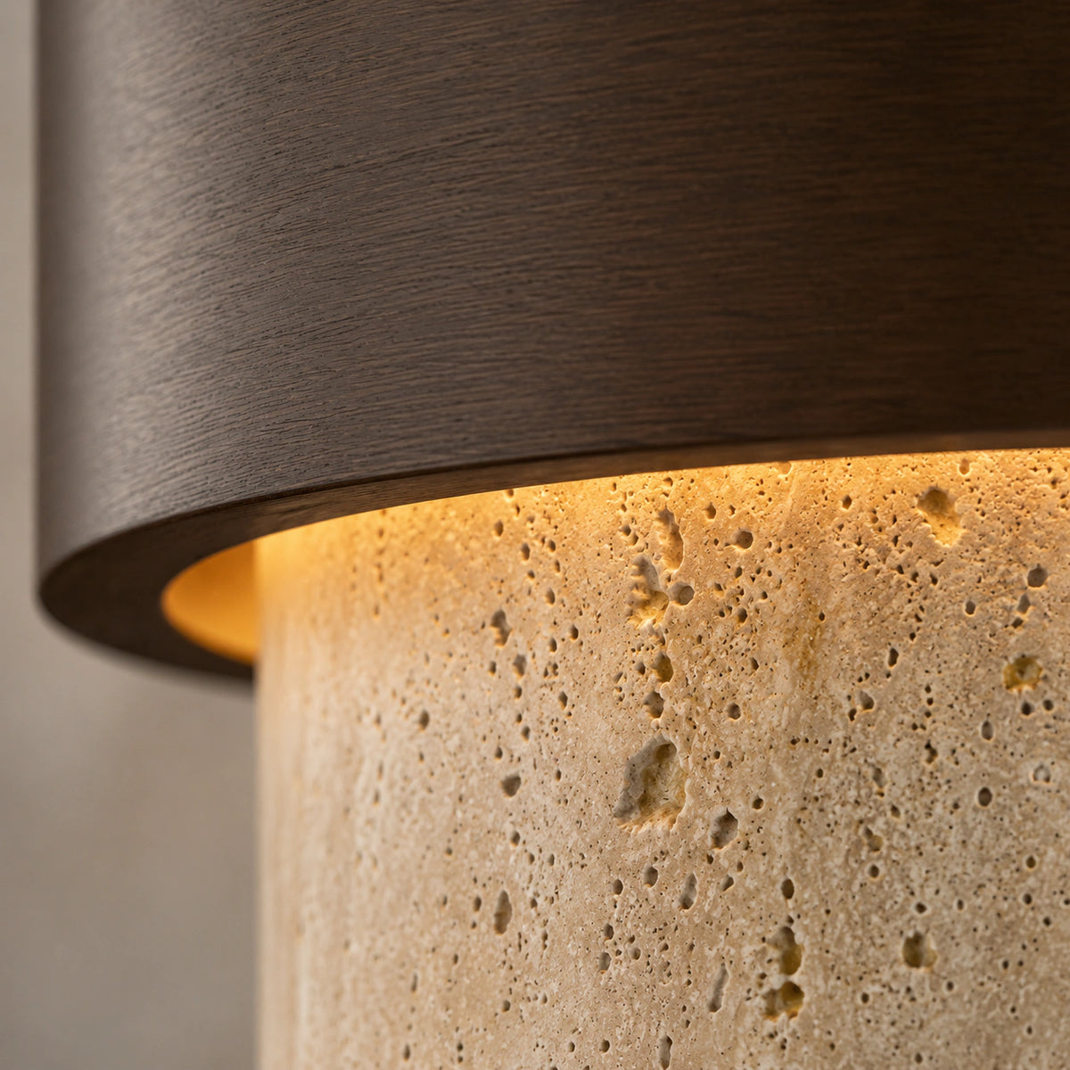 Close-up of the travertine grain on the cream tiered ceiling light