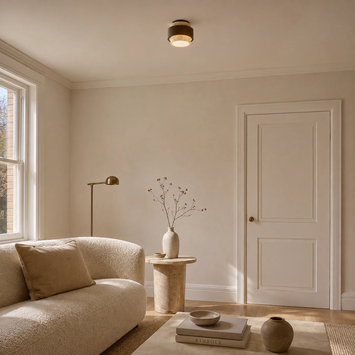Cream travertine tiered ceiling light in a calm neutral living room