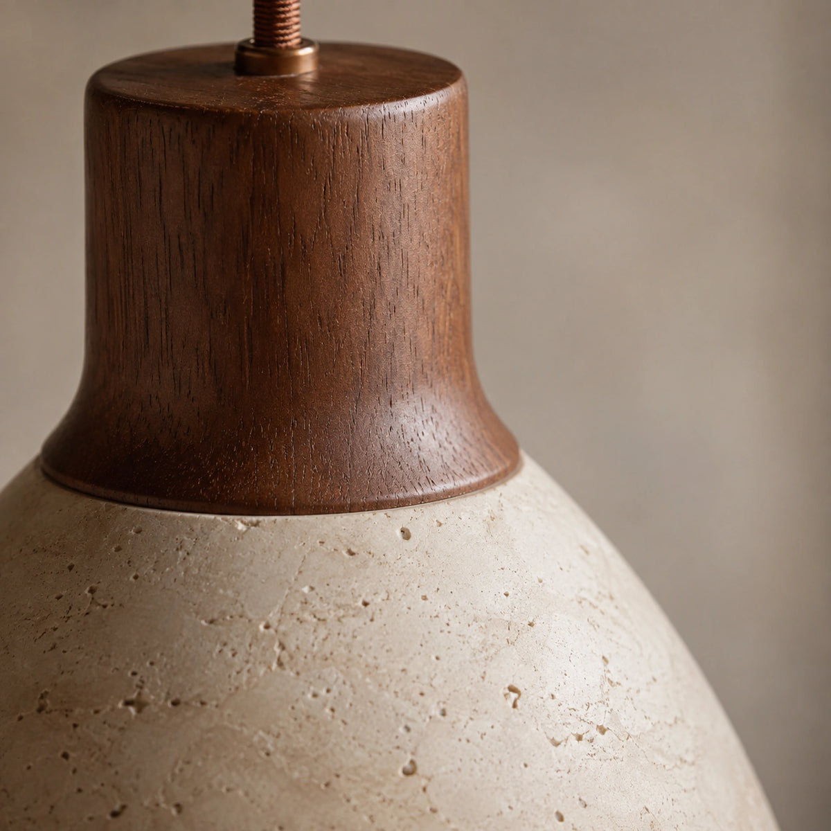 Close-up of the curved travertine banding and walnut neck on the Wickham bell pendant