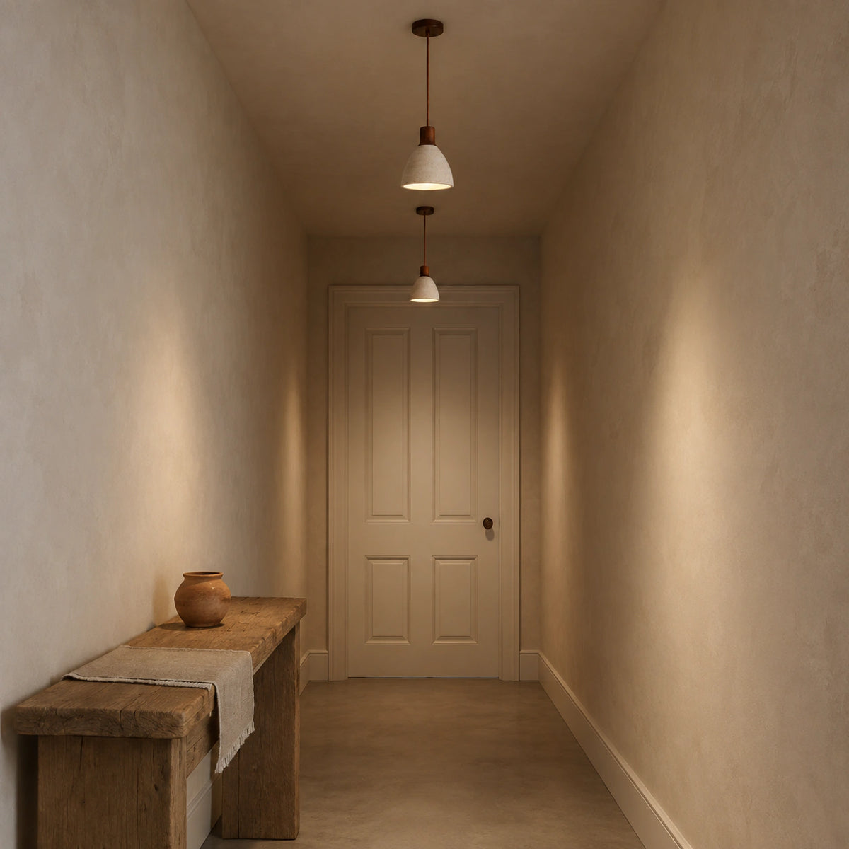 Wickham travertine bell pendant in walnut lighting a hallway with panelled doors