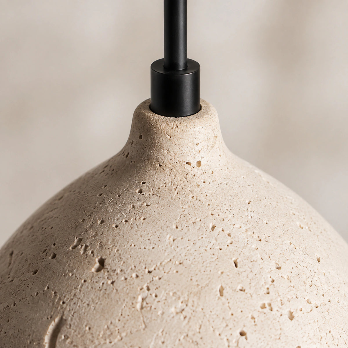 Close-up of the open pores and banding on the Windrush travertine bell pendant