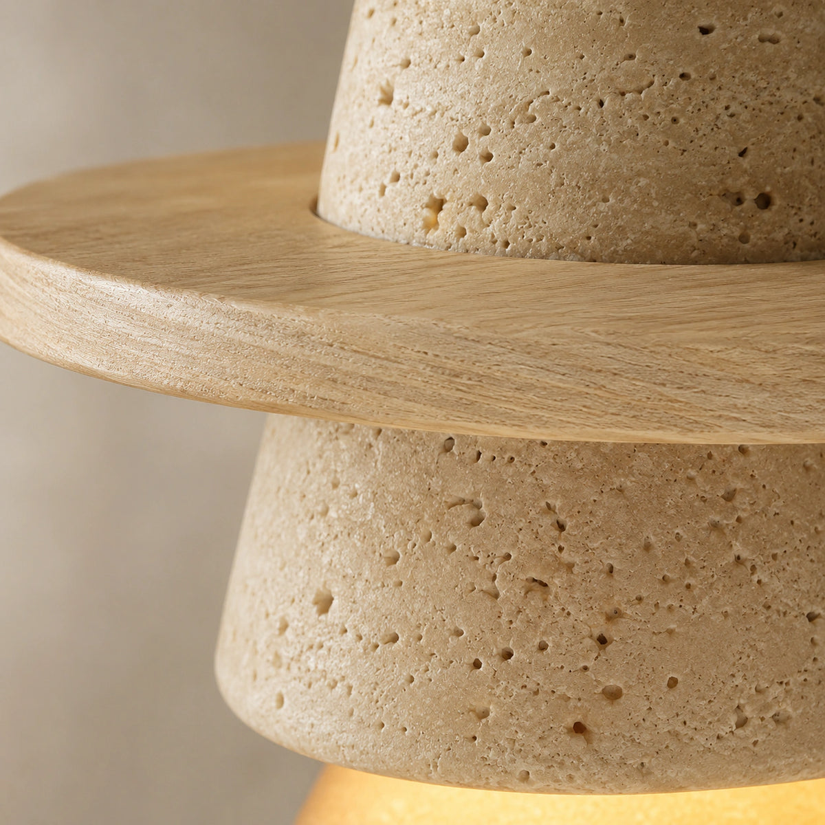 Close-up of the travertine grain on the oak version of the cone pendant