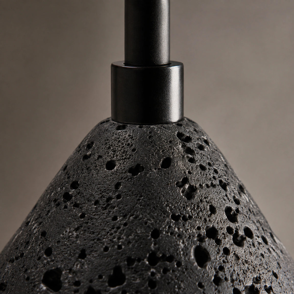 Close-up of the pale flecks in the black travertine on the Skye cone pendant
