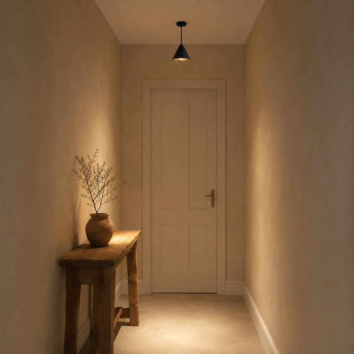 Skye cone pendant in black travertine lighting a hallway in a period property