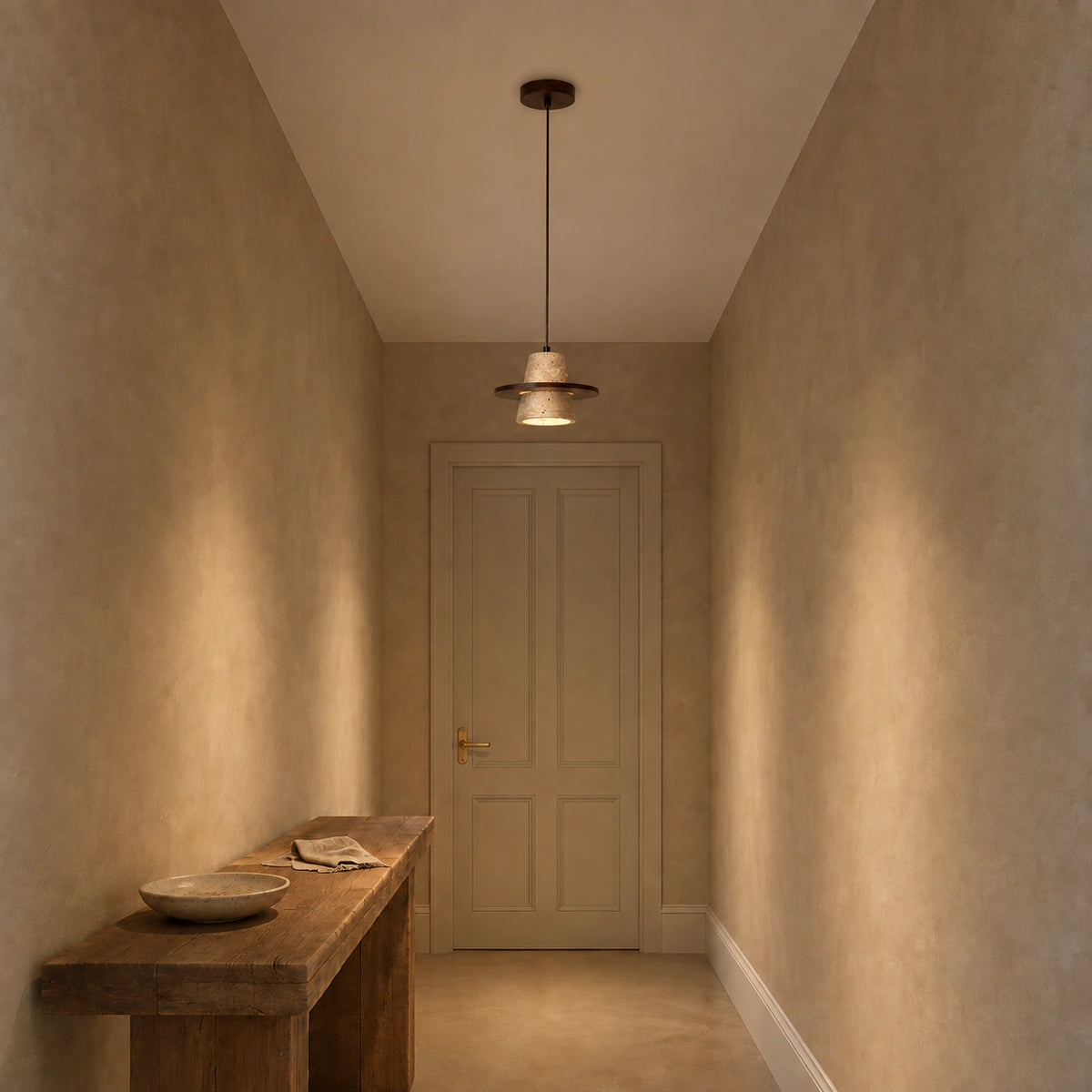 Travertine cone pendant lighting a plastered hallway
