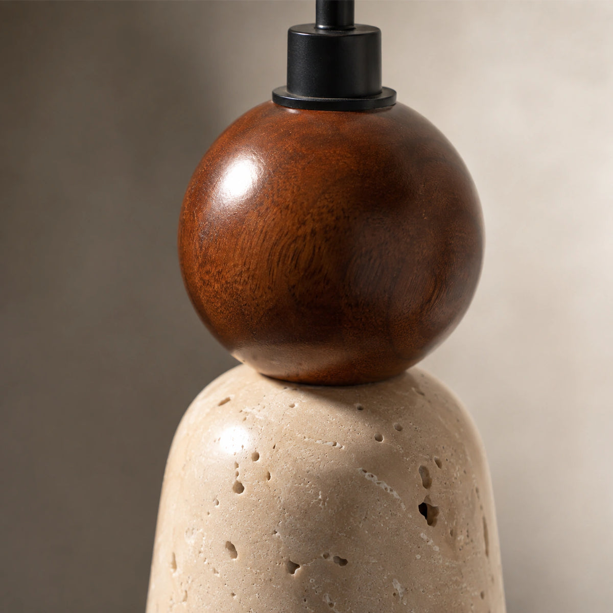 Close-up of the travertine grain and open pores on the Tilney cone pendant