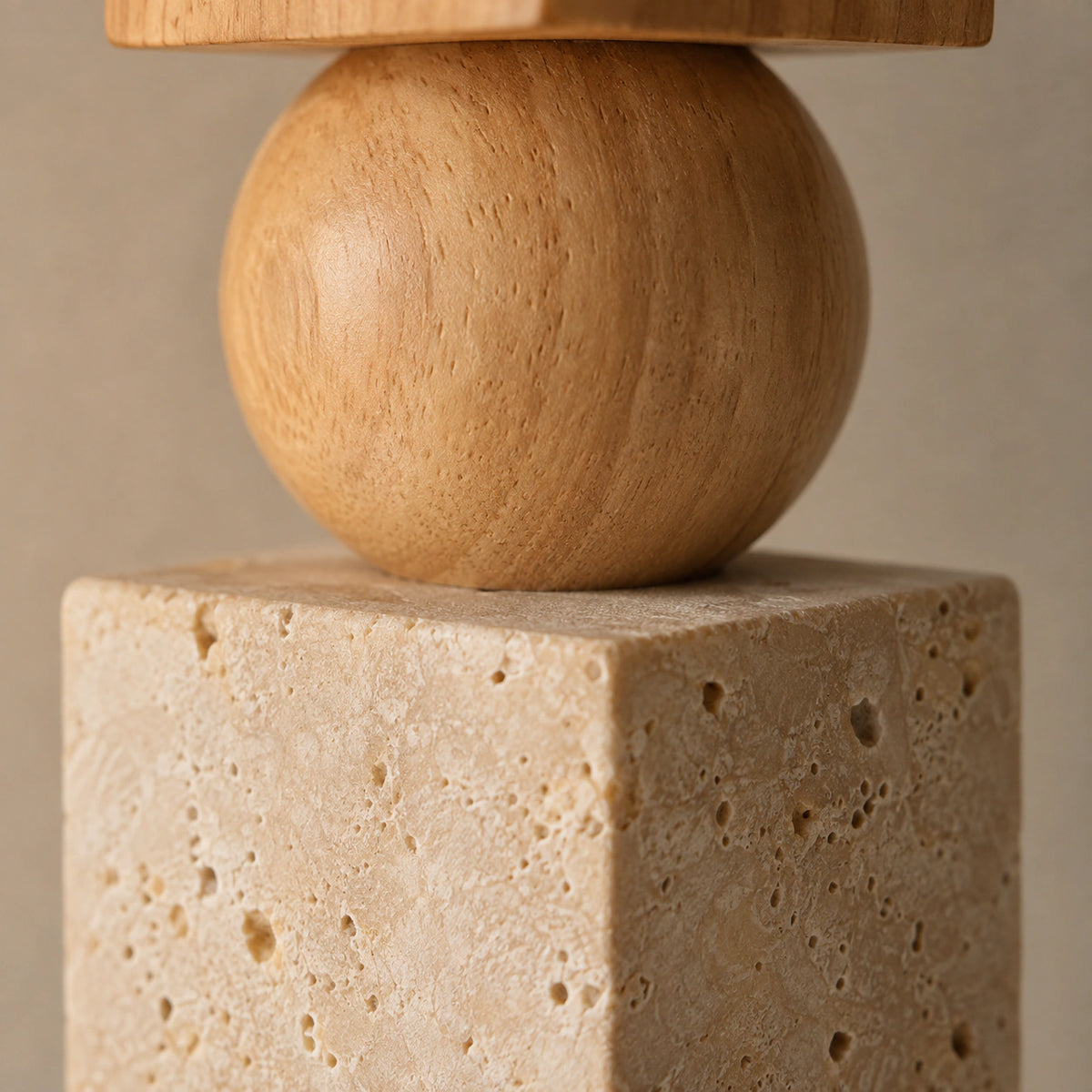 Close-up of the travertine grain on the flat face of the Cranbrook square pendant