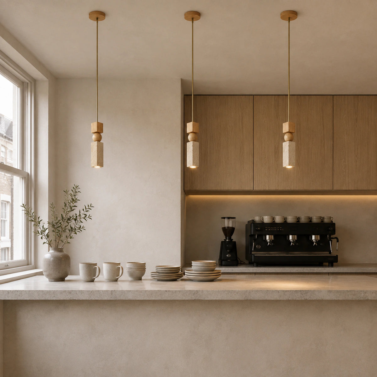 Cranbrook square travertine pendant above the counter of a warm, minimalist cafe