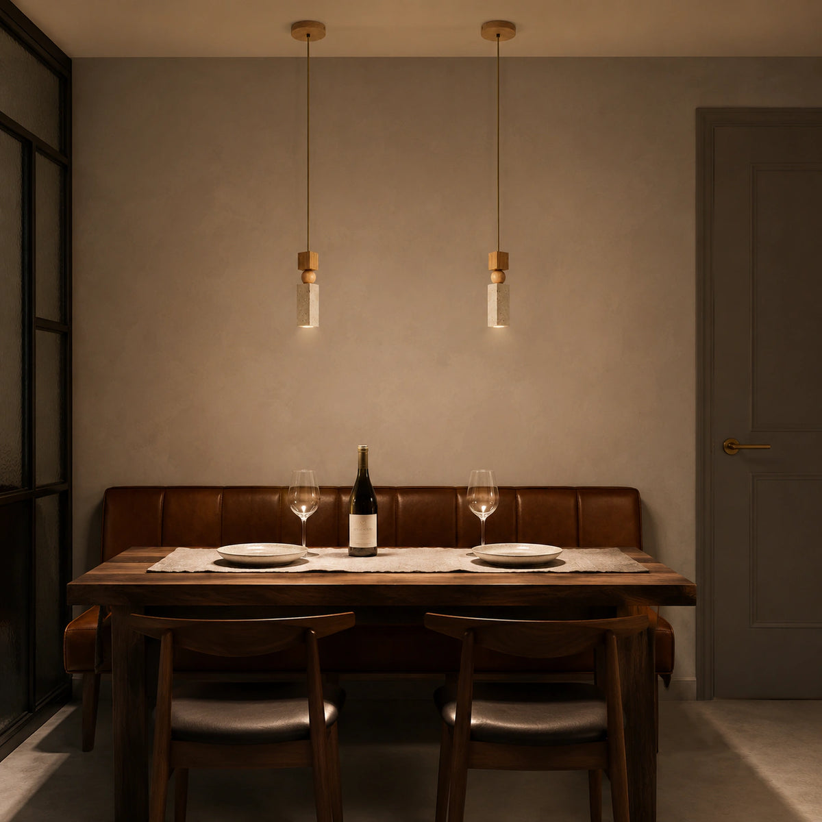 Cranbrook square travertine pendant hanging above a dining table in a minimalist room