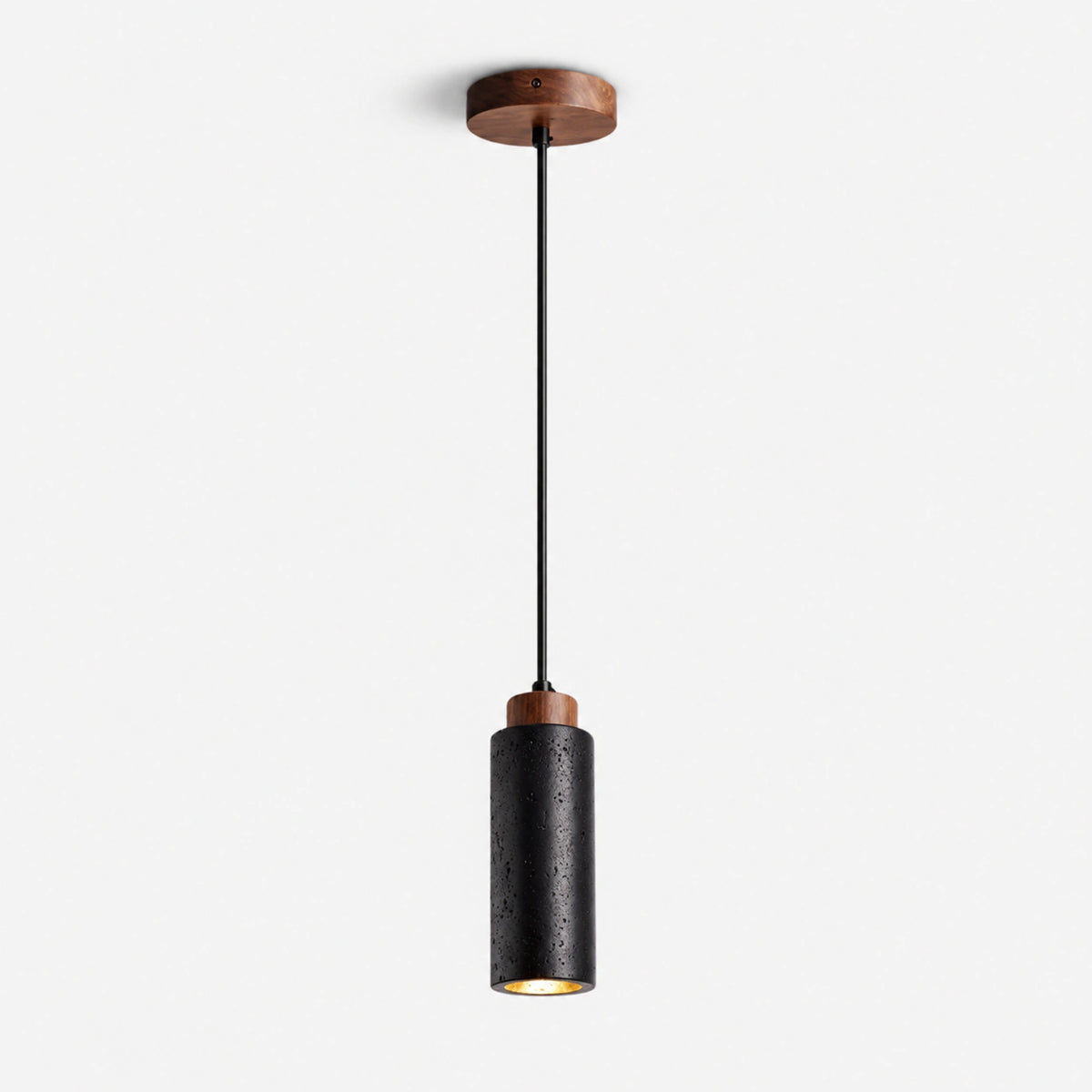 Slim black travertine cylinder pendant light with a wooden cap on a white background
