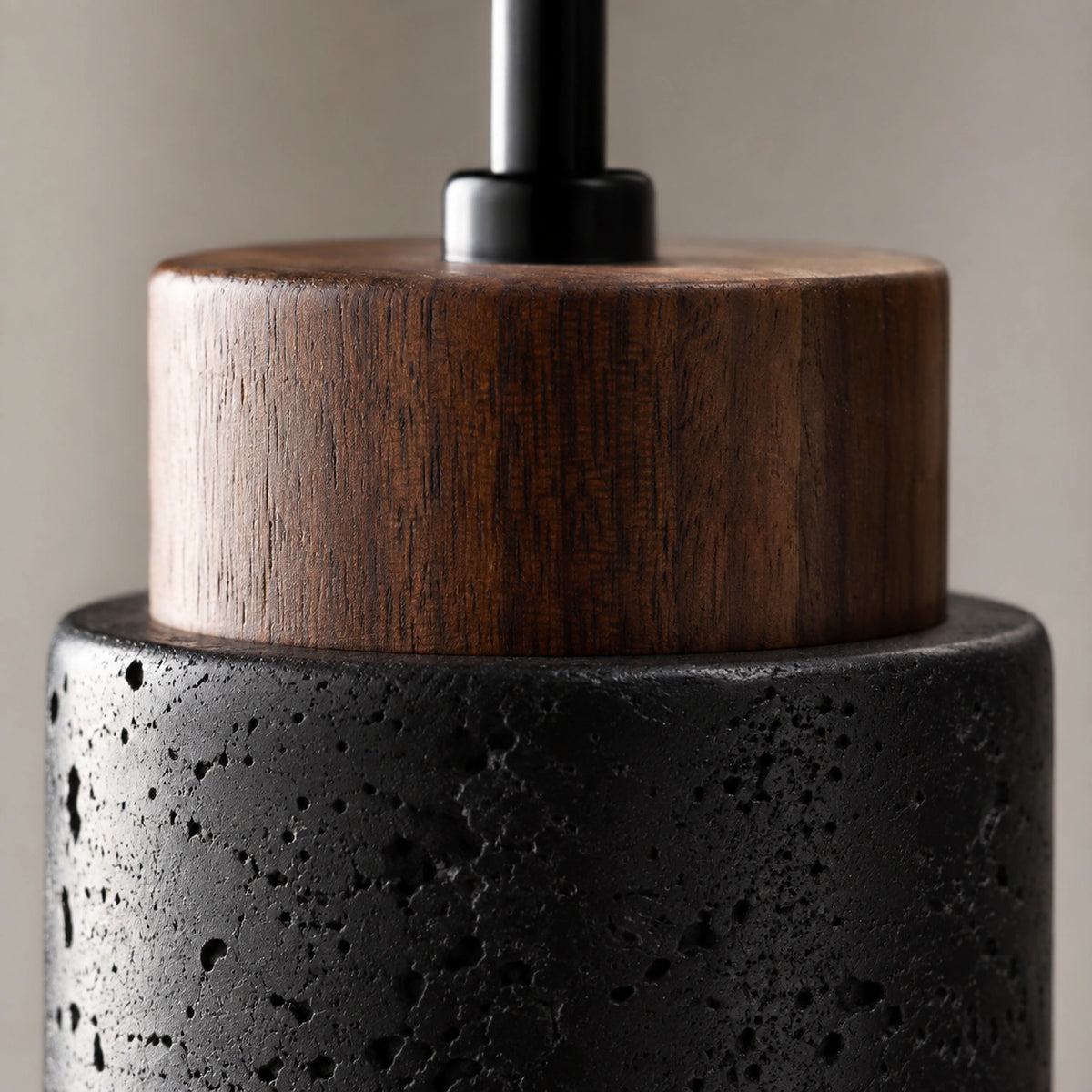 Close-up of the pale flecks in the black travertine on the Otley cylinder pendant