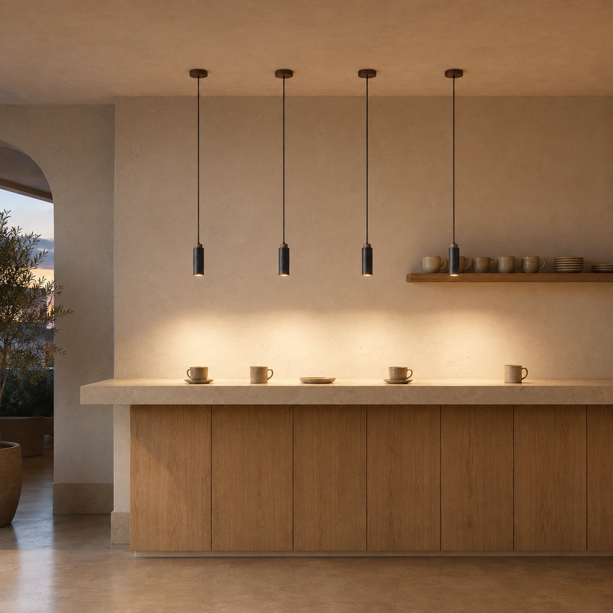 Otley pendant in black travertine above the counter of a warm, minimalist cafe