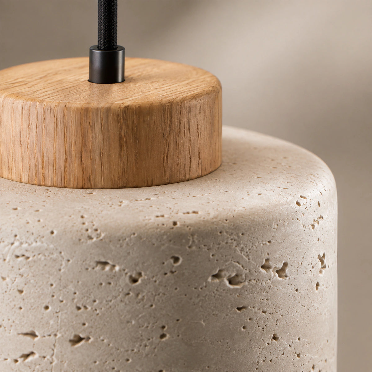 Close-up of the travertine grain and oak collar on the Fairlie cylinder pendant