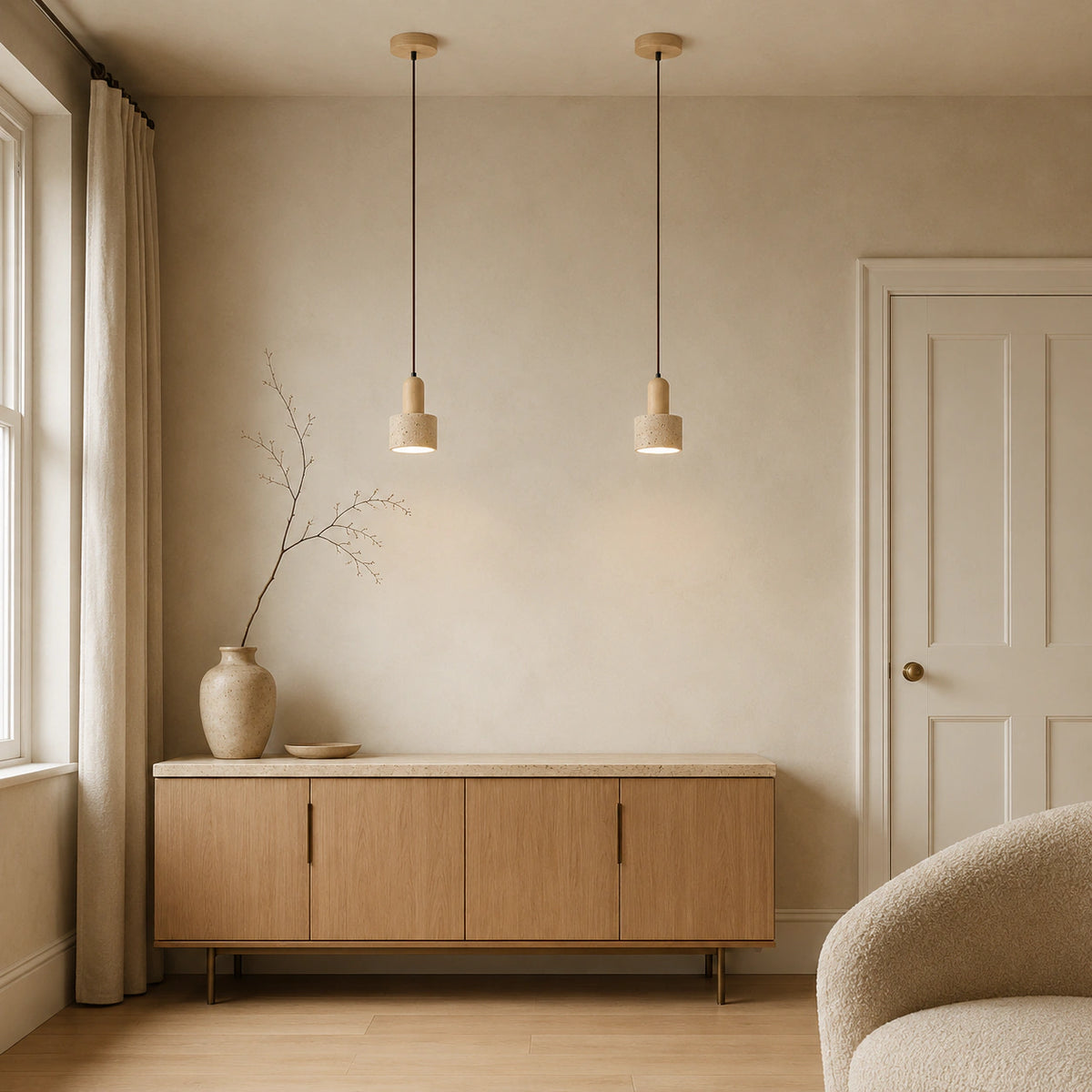 Grantley pendant in oak and cream travertine in a calm living room with neutral furnishings