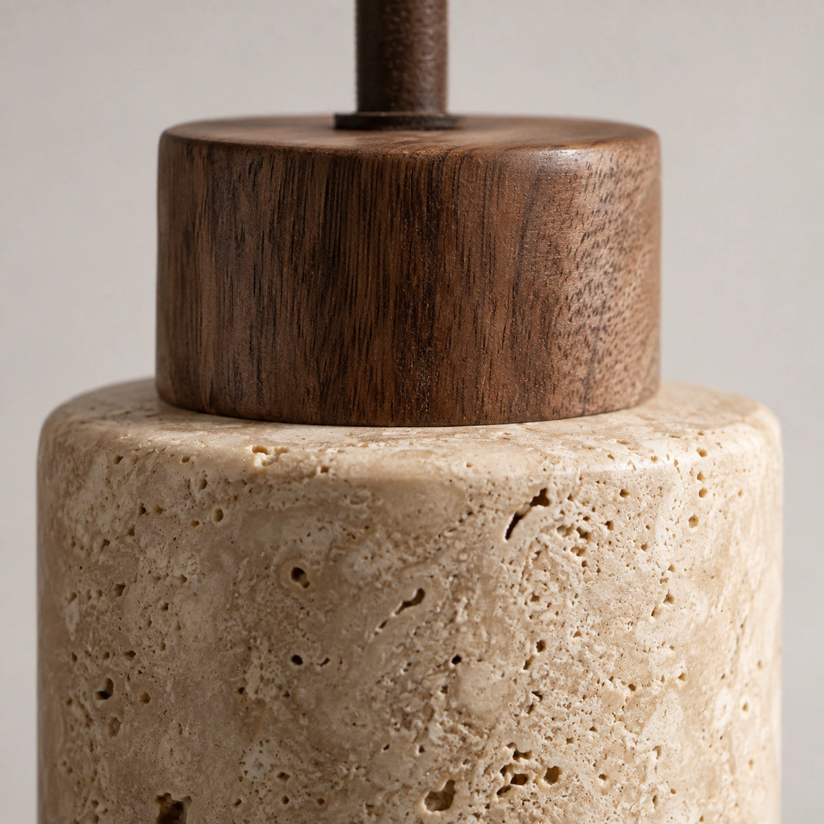 Close-up of the honey travertine grain on the Otley cylinder pendant