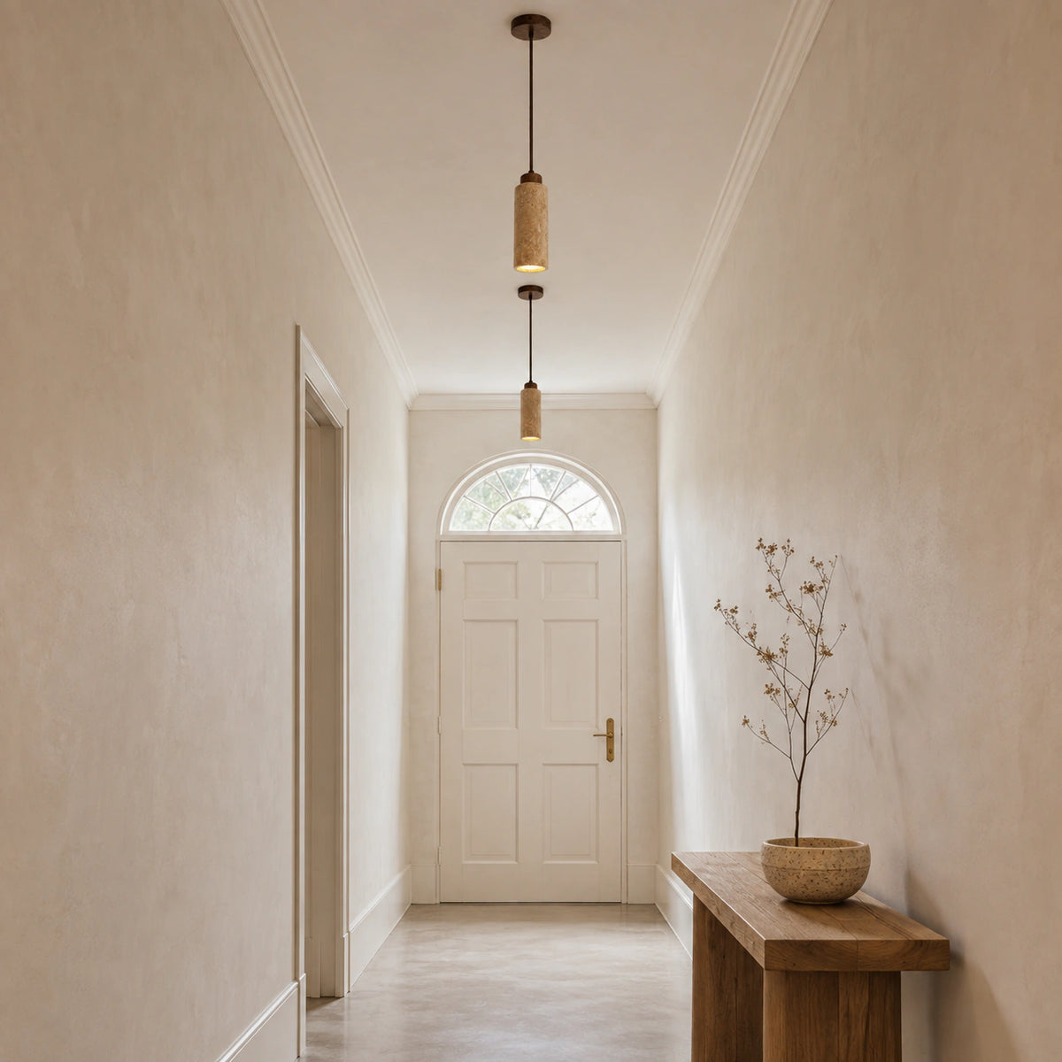 Otley pendant in honey travertine lighting a hallway in a period property